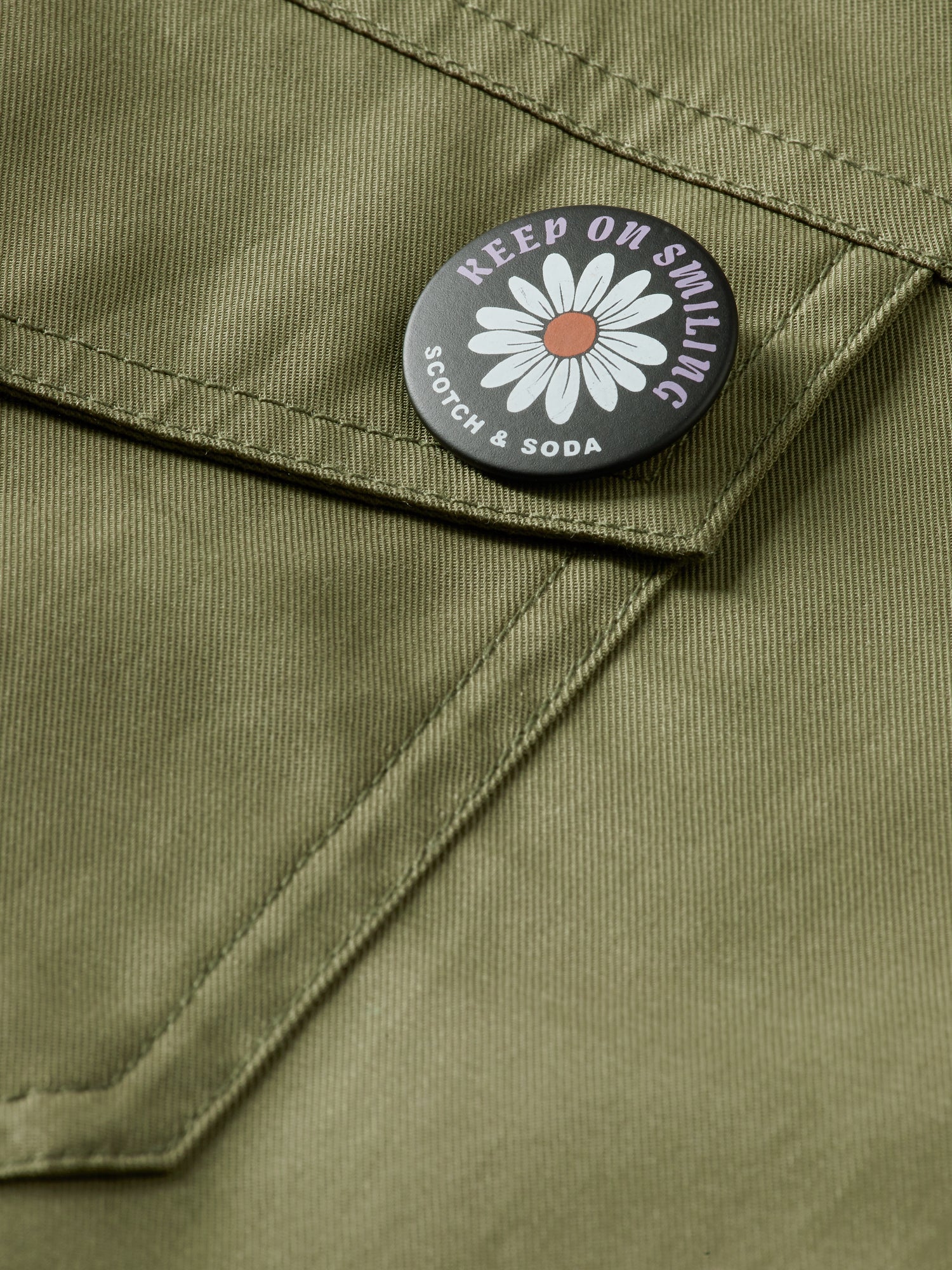 SCOTCH & SODA military playsuit, stylish jumpsuit with button details and cargo pockets, casual fashion outfit.