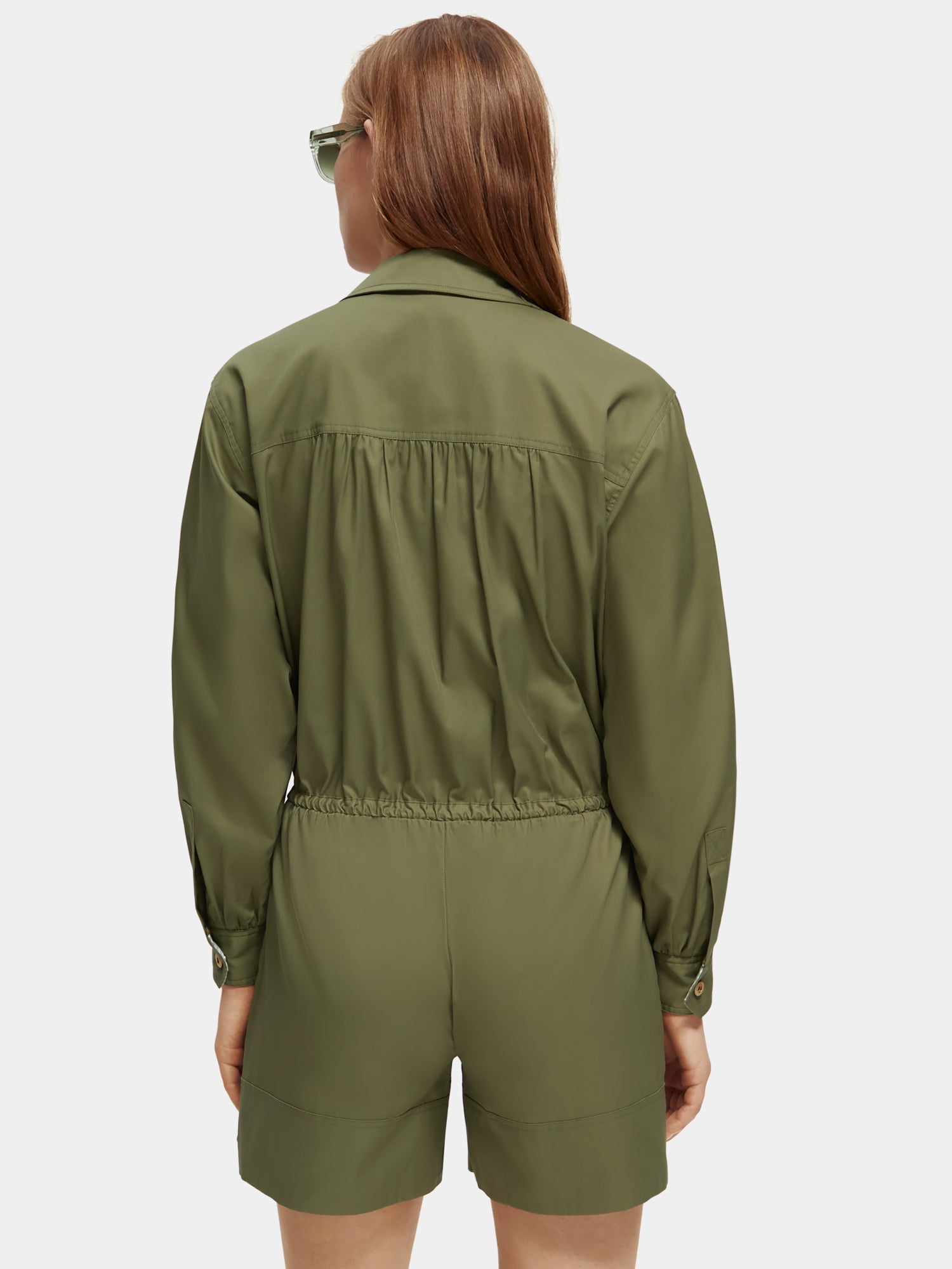 SCOTCH & SODA military playsuit jumpsuit with short sleeves and cargo pockets, styled with a back view.