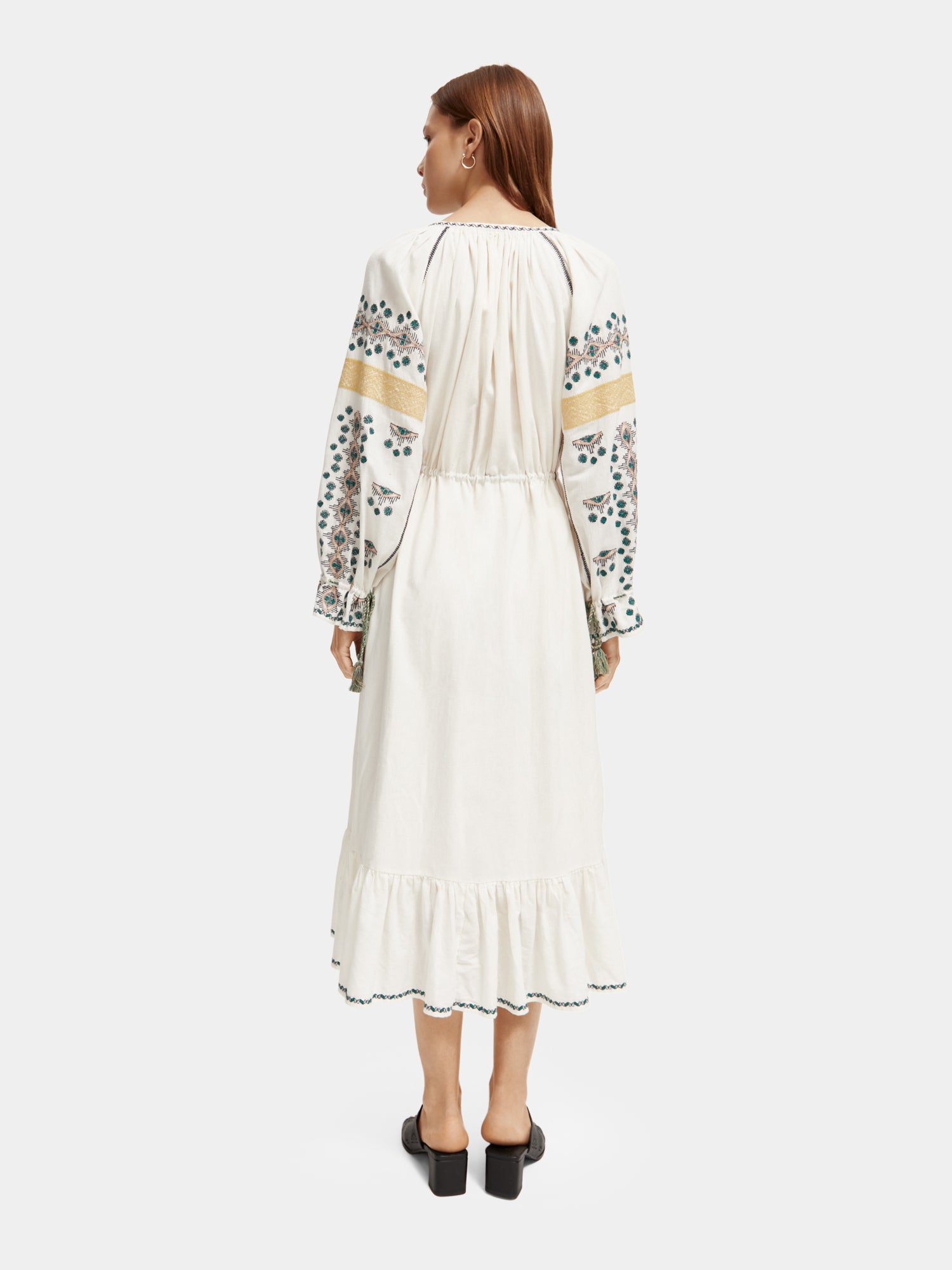 Embroidered v-neck maxi dress by Scotch & Soda featuring intricate embroidery and flowing fabric, displayed on a hanger.