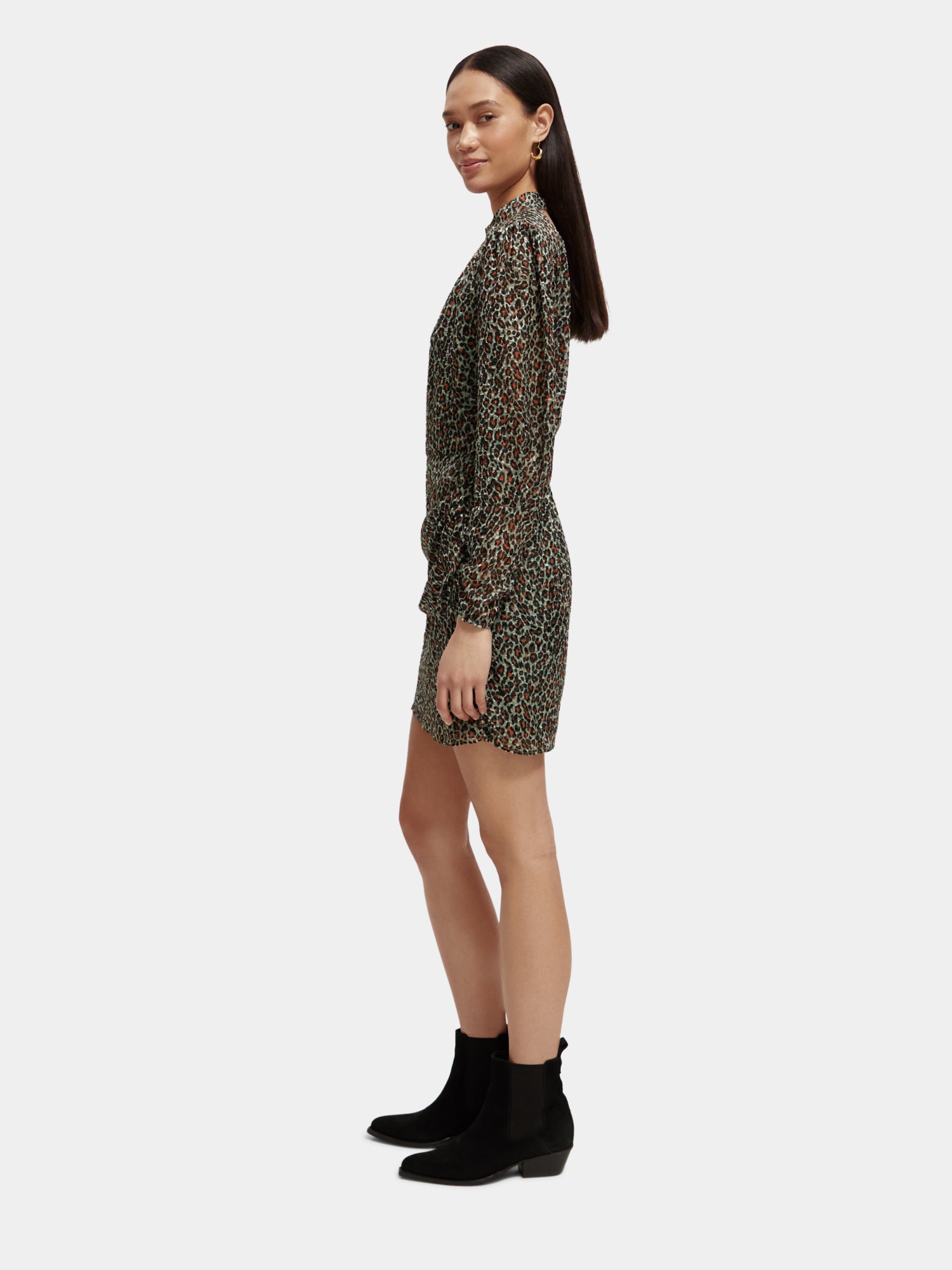 Black mock neck mini dress by Scotch & Soda, featuring a fitted silhouette and long sleeves, suitable for stylish casual wear.