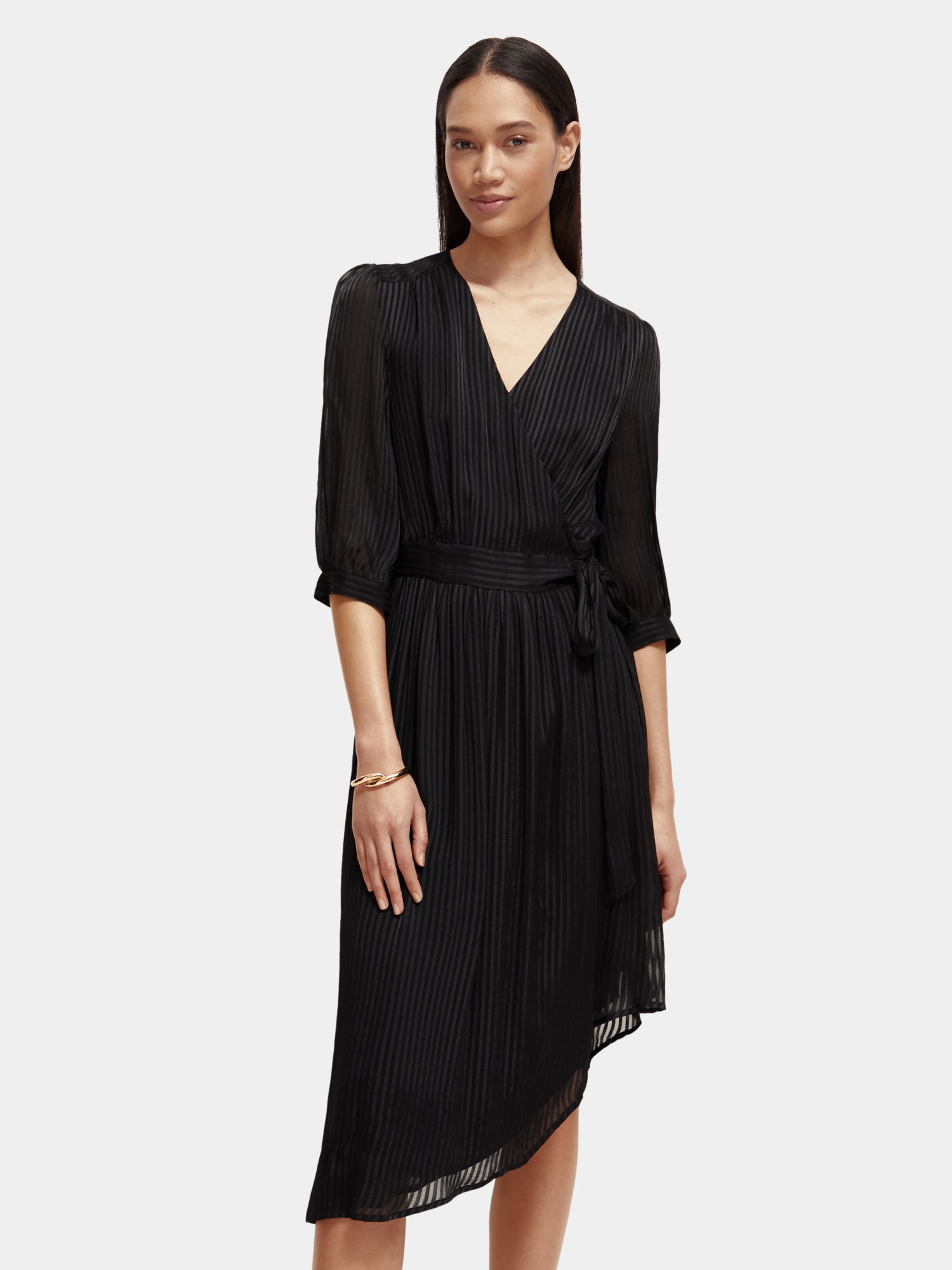 Scotch & Soda V-neck midi dress in a floral print, sleeveless design, flowing fabric, and knee-length silhouette.
