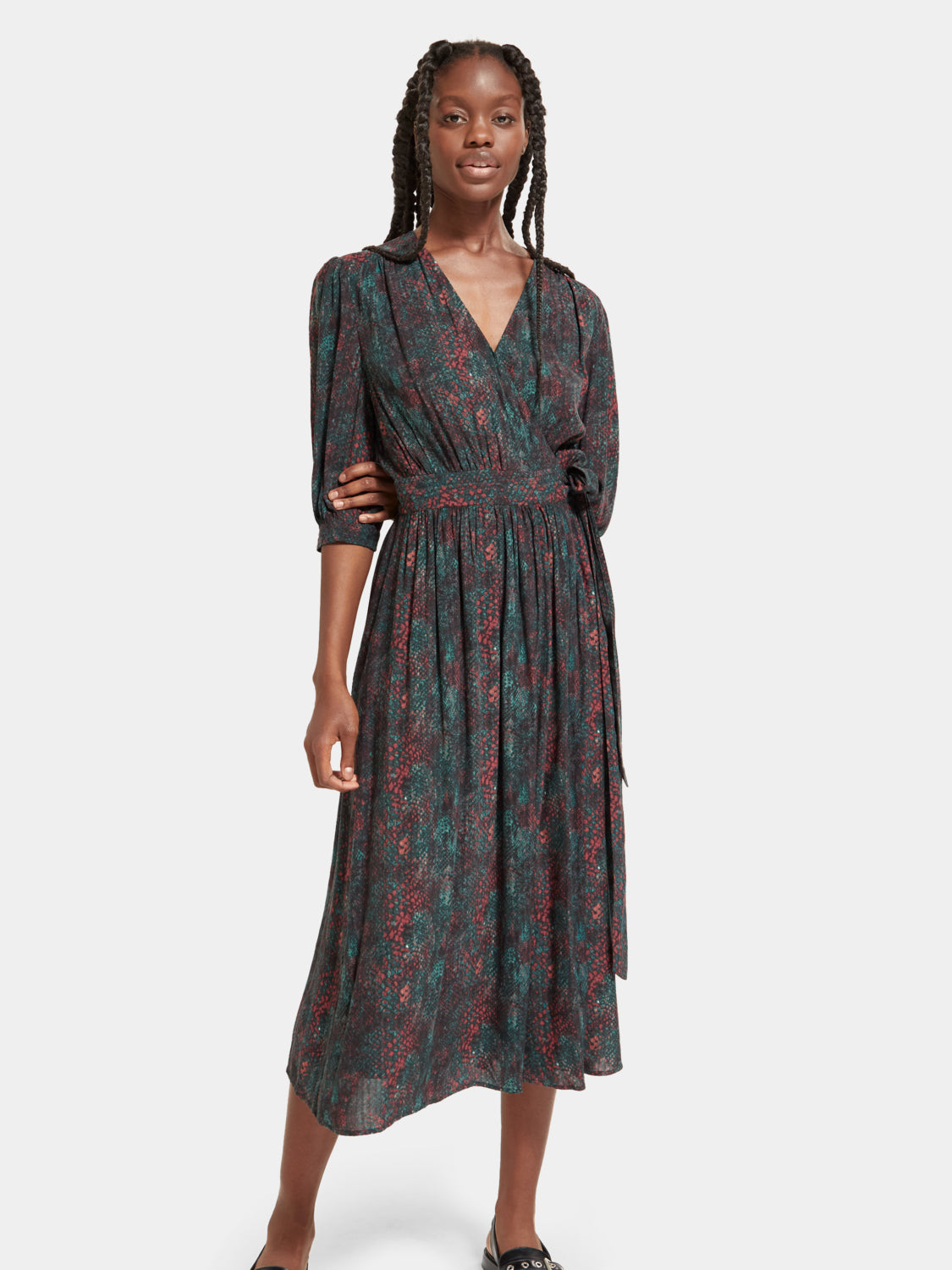 SCOTCH & SODA midi wrap dress featuring a floral pattern, V-neckline, and long sleeves, displayed on a hanger.