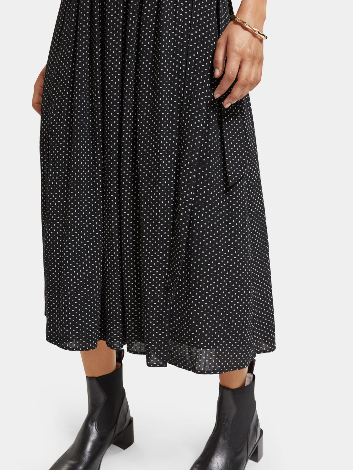 Scotch & Soda midi wrap dress in floral fabric, featuring long sleeves and a tie waist, displayed on a hanger.