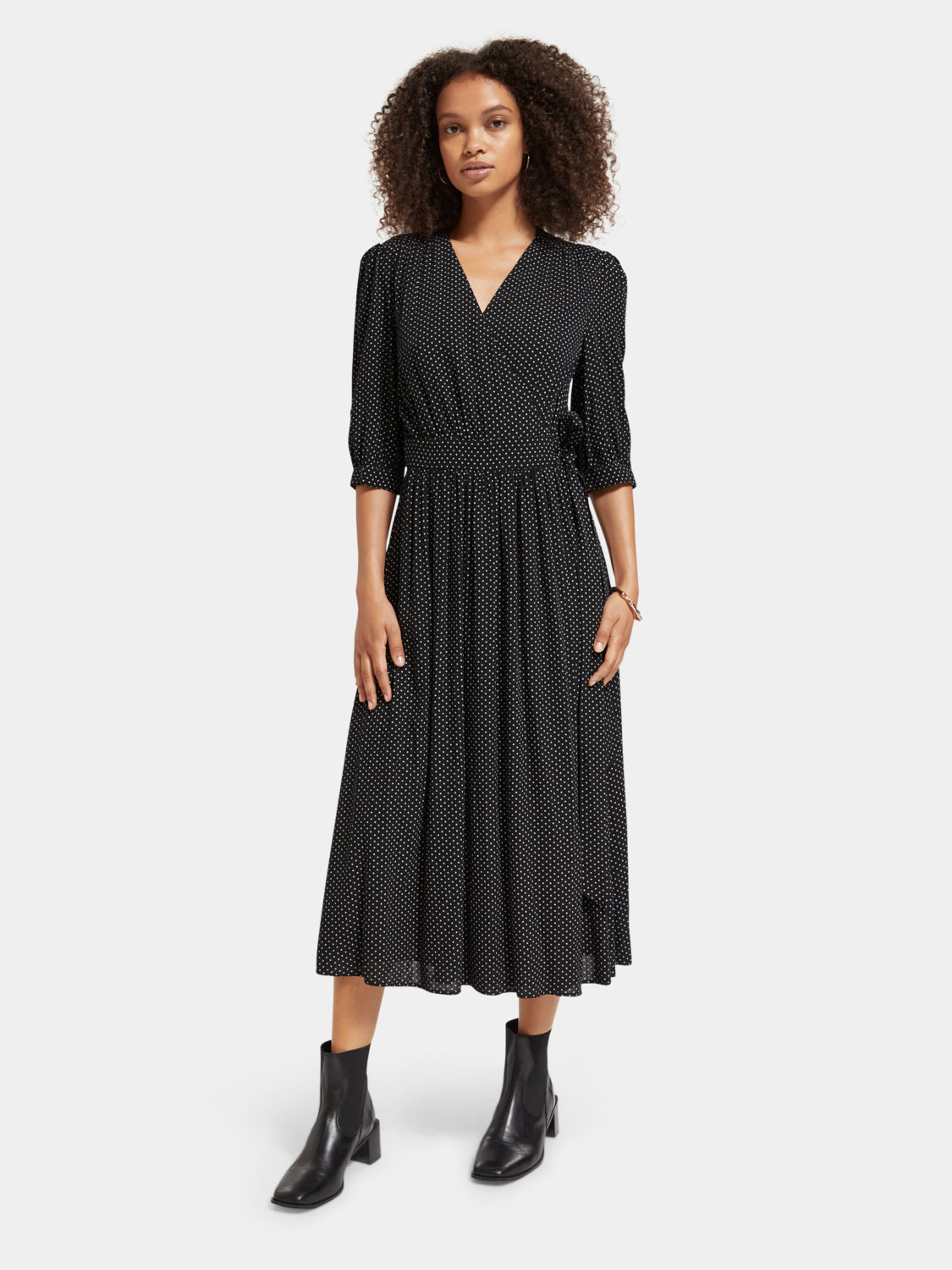 SCOTCH & SODA midi wrap dress shown on a model with floral pattern and long sleeves, stylish and elegant for casual or formal wear.