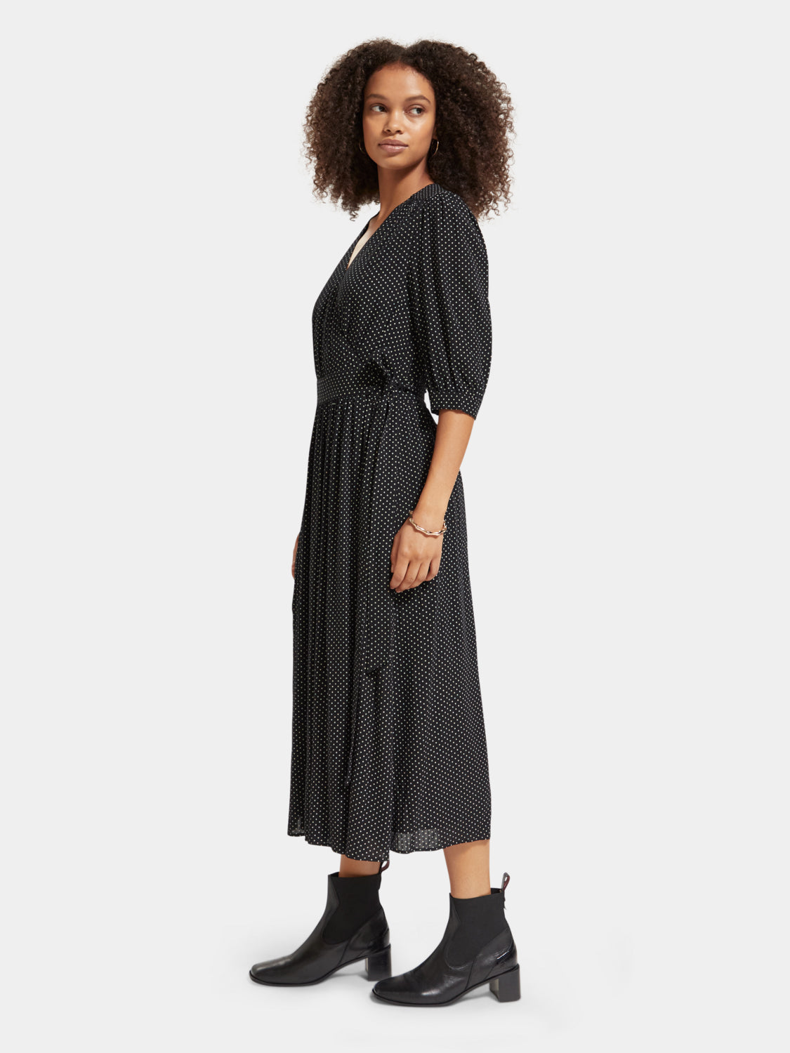 Scotch & Soda midi wrap dress with floral pattern, V-neckline, and long sleeves, shown on a hanger.