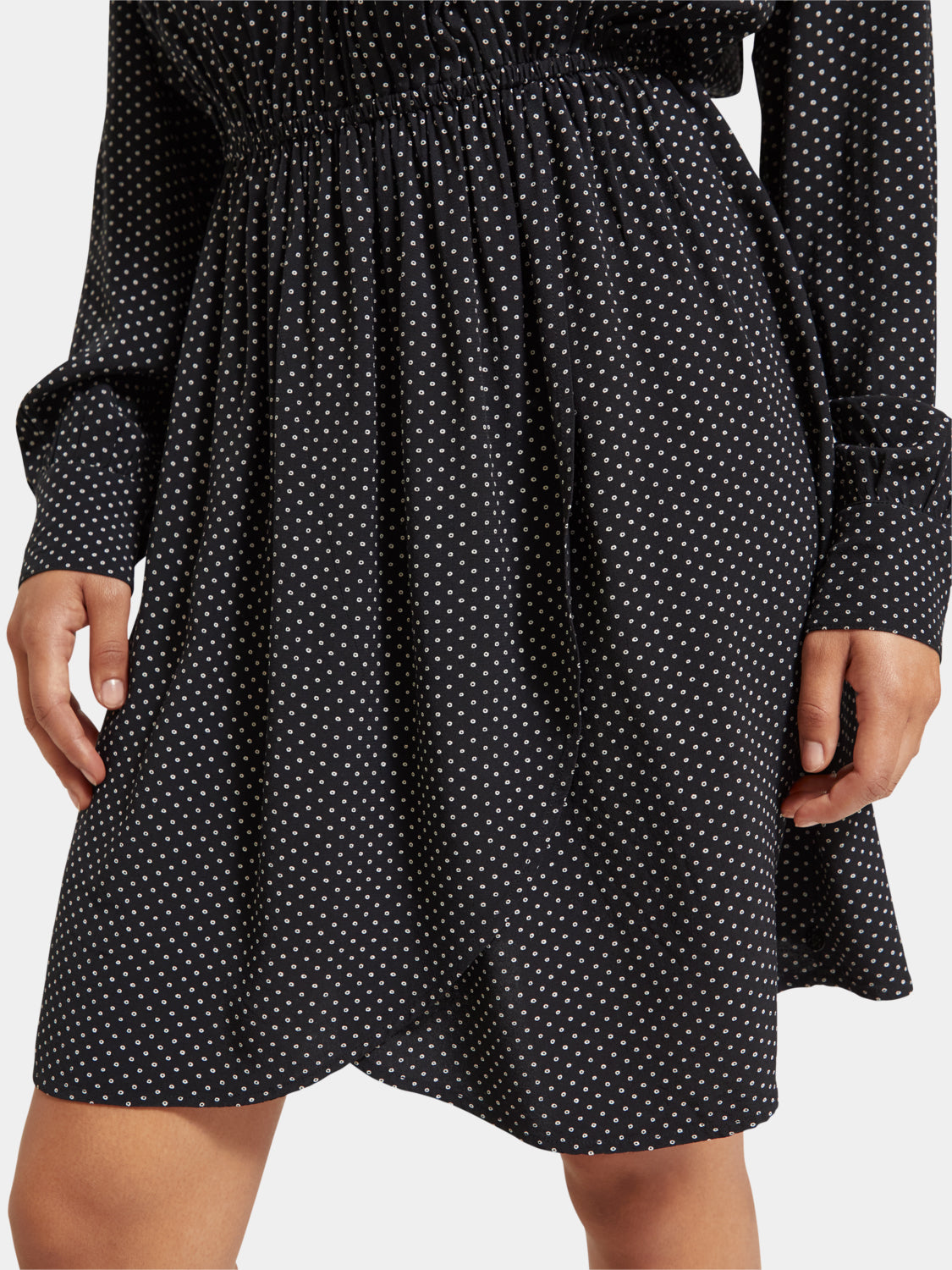 Printed mini dress from Scotch & Soda with vibrant floral pattern, short sleeves, and fitted silhouette.
