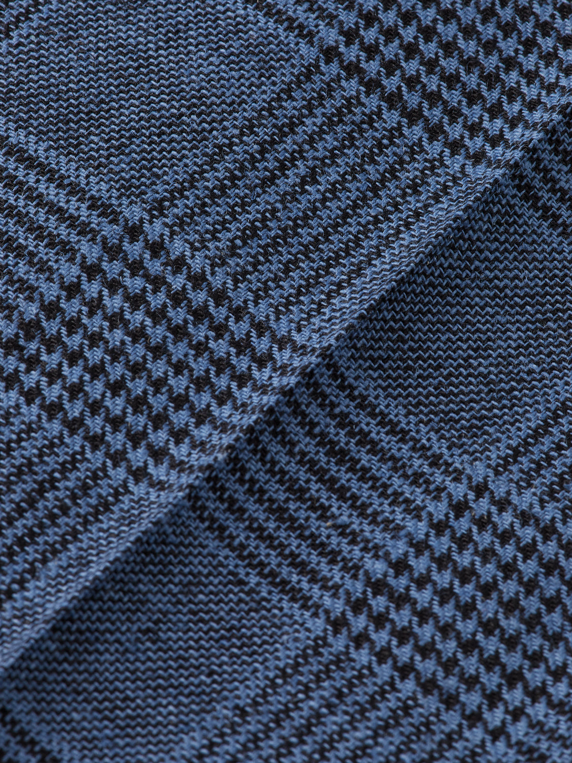 Wide leg pleated check chinos pants by Scotch & Soda, featuring a relaxed fit and classic pattern, shown on a model.