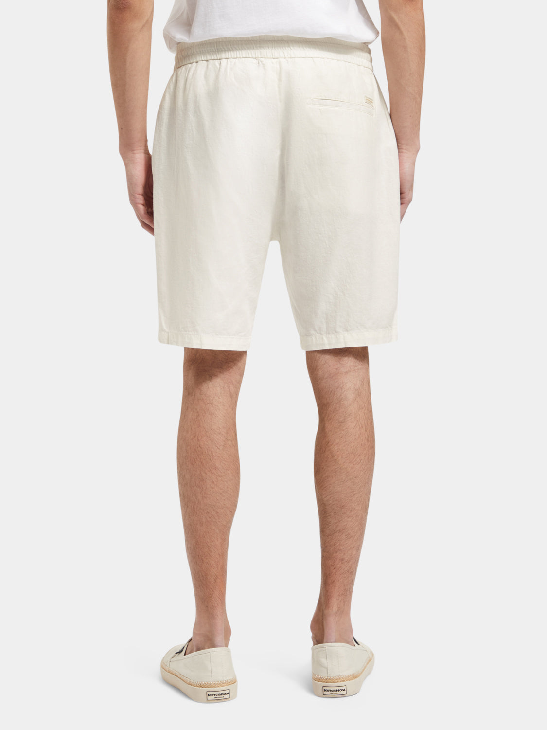 SCOTCH & SODA Fave cotton-linen shorts shown from the back, featuring a relaxed fit and natural fabric texture.