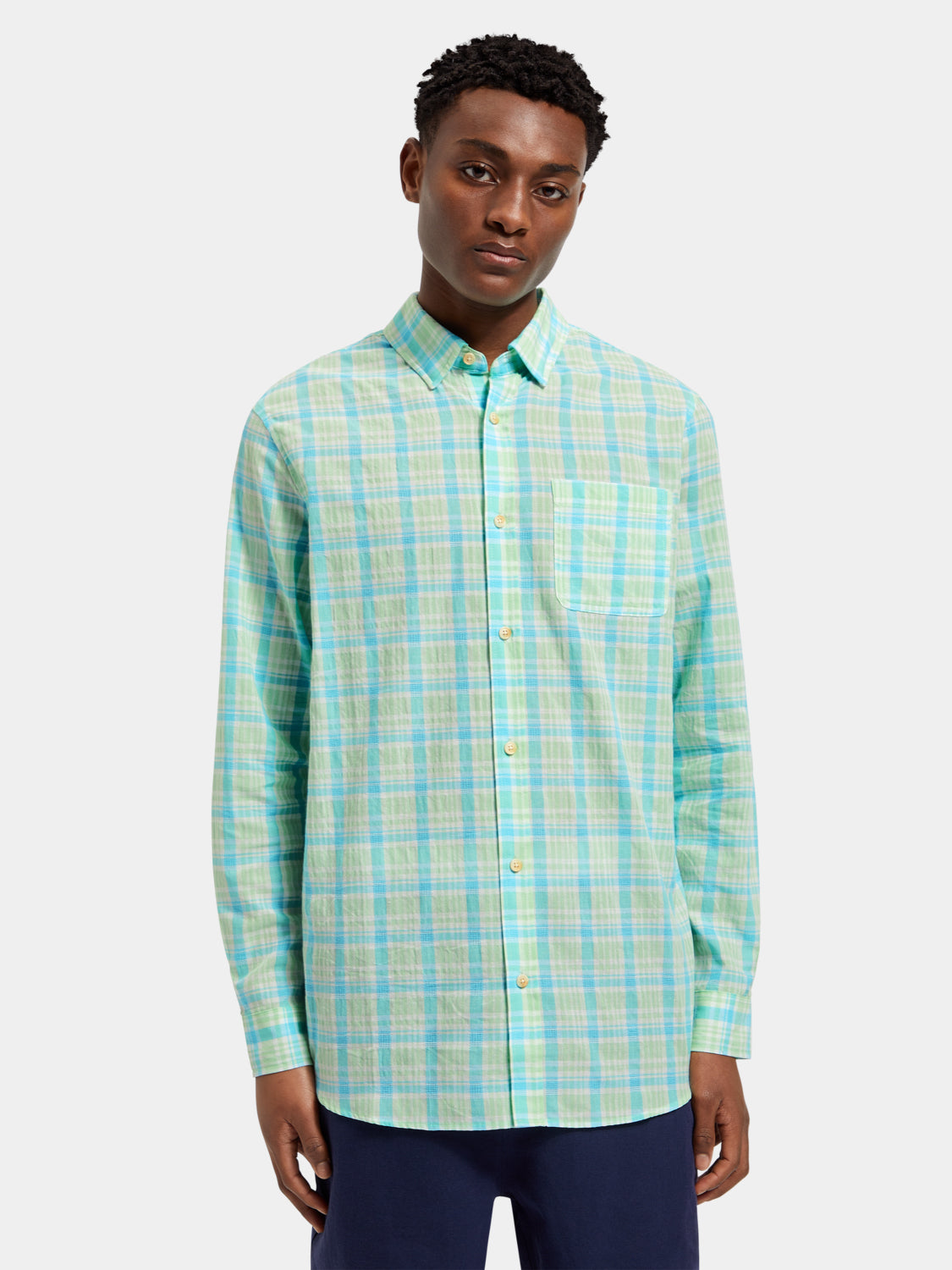 Long-sleeve neon check shirt by Scotch & Soda, featuring vibrant pattern and casual fit, displayed on a hanger.