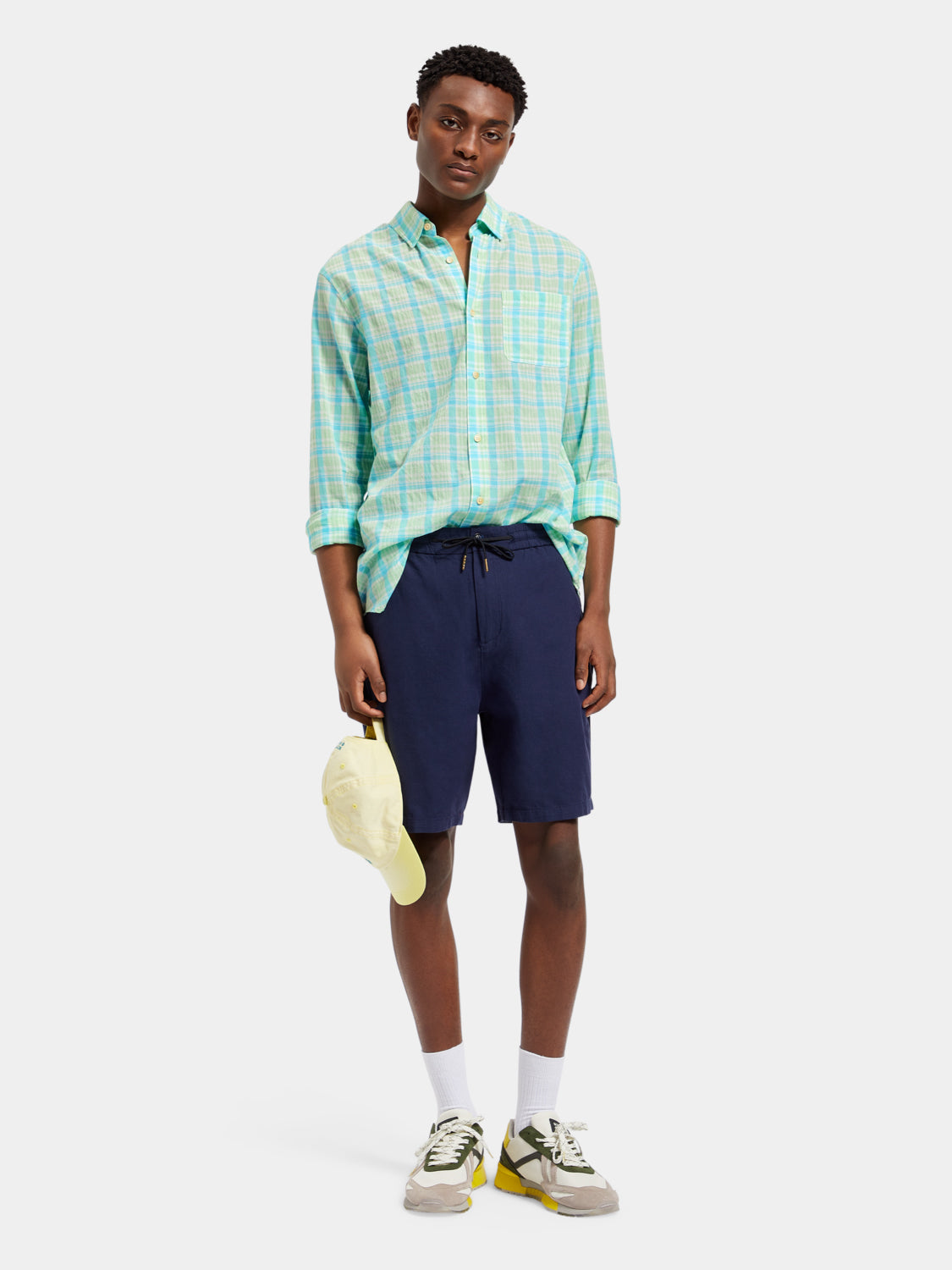 Long sleeve neon check shirt by Scotch & Soda, featuring vibrant pattern and classic collar, displayed on a mannequin.
