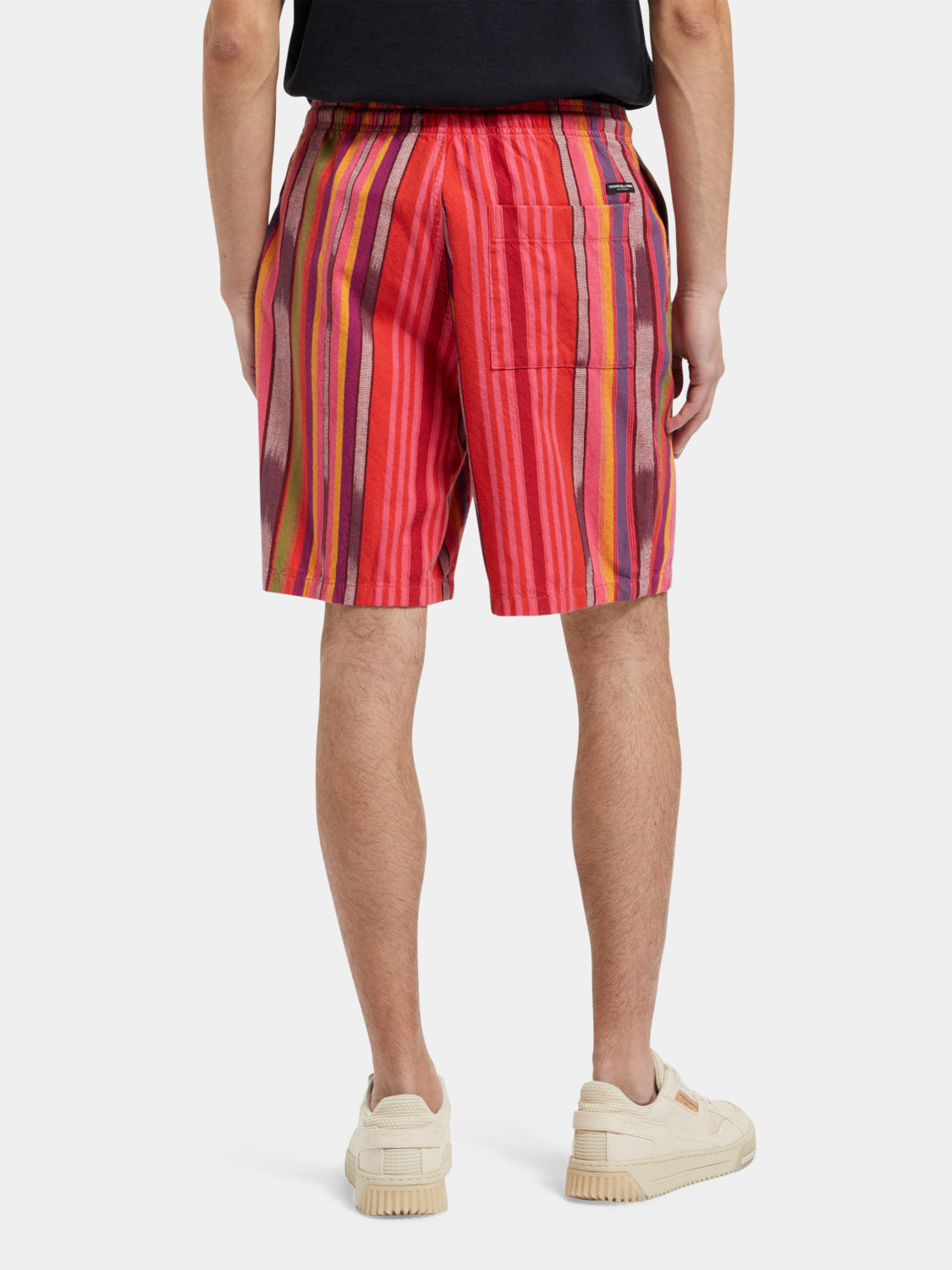 Striped Oxford shorts by Scotch & Soda showing a relaxed fit with blue and white vertical stripes.