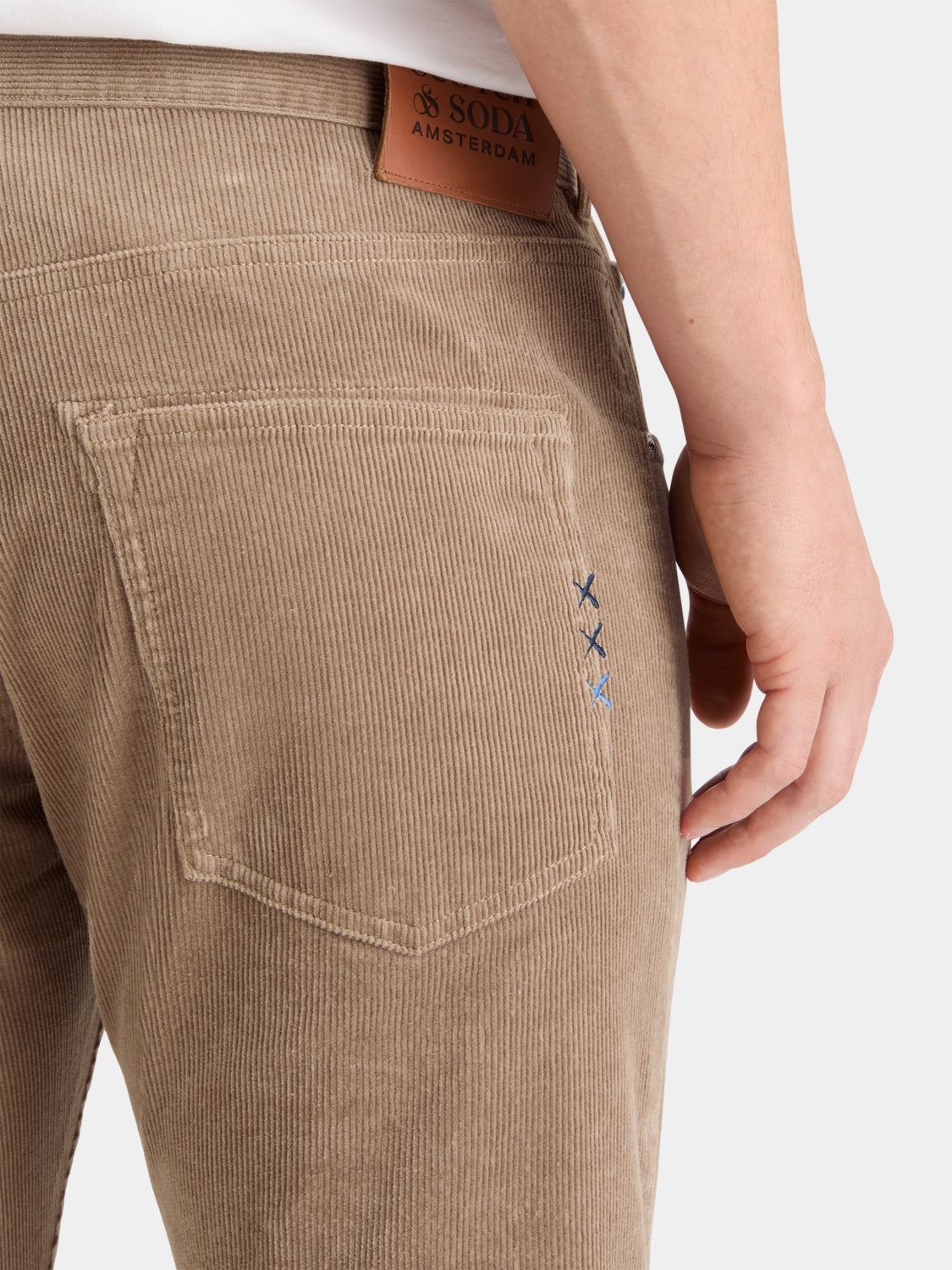 SCOTCH & SODA Ralston corduroy pants in tan with a relaxed fit, featuring visible waistband and front pockets.
