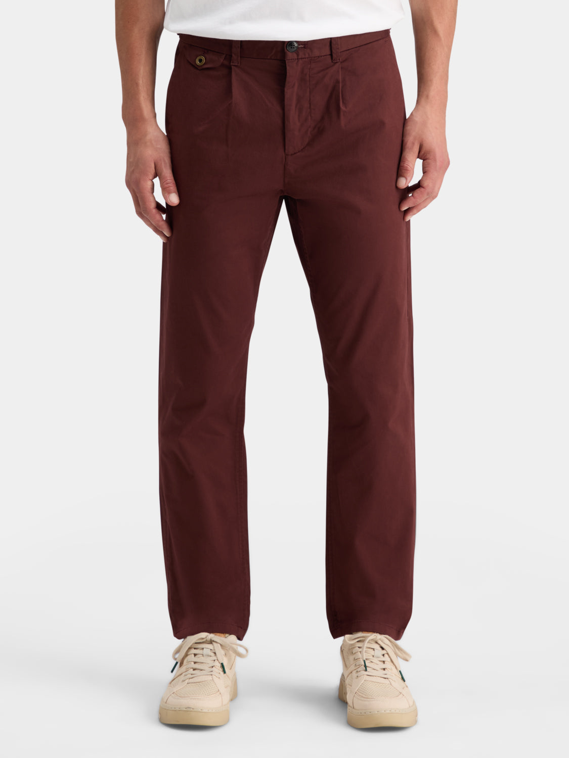 Slim fit Blake chinos by Scotch & Soda in khaki color, showing the front view with belt loops and pockets.
