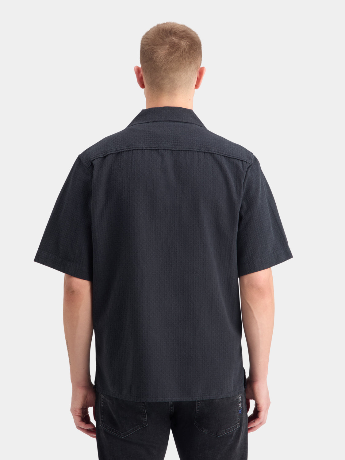 Light blue Scotch & Soda structured dobby short-sleeve shirt with a textured pattern and classic collar, back view.