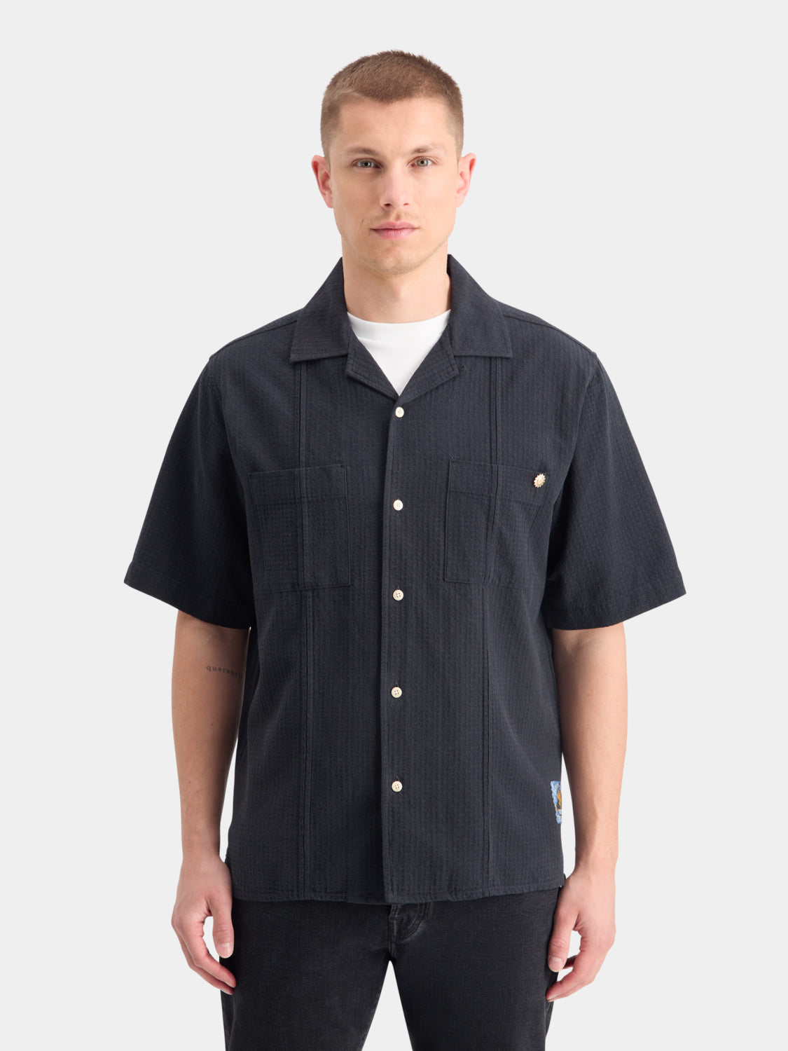 Light blue Scotch & Soda structured dobby shirt with short sleeves and a classic collar, displayed on a hanger.