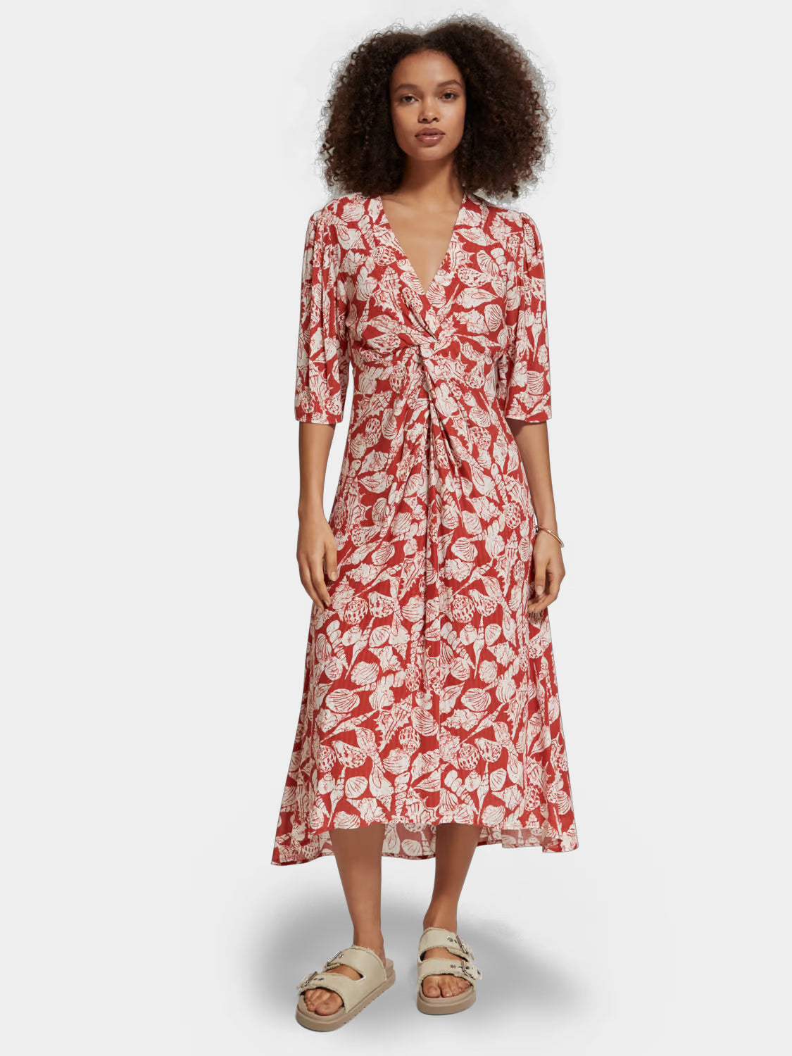 Scotch & Soda knotted midi wrap dress showcasing a stylish design with a fitted waist and flowing skirt.