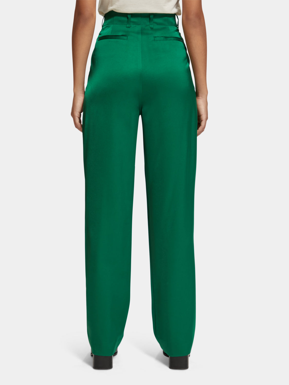SCOTCH & SODA Faye tapered pants shown from the back, featuring a sleek fit and tailored design in a dark fabric.