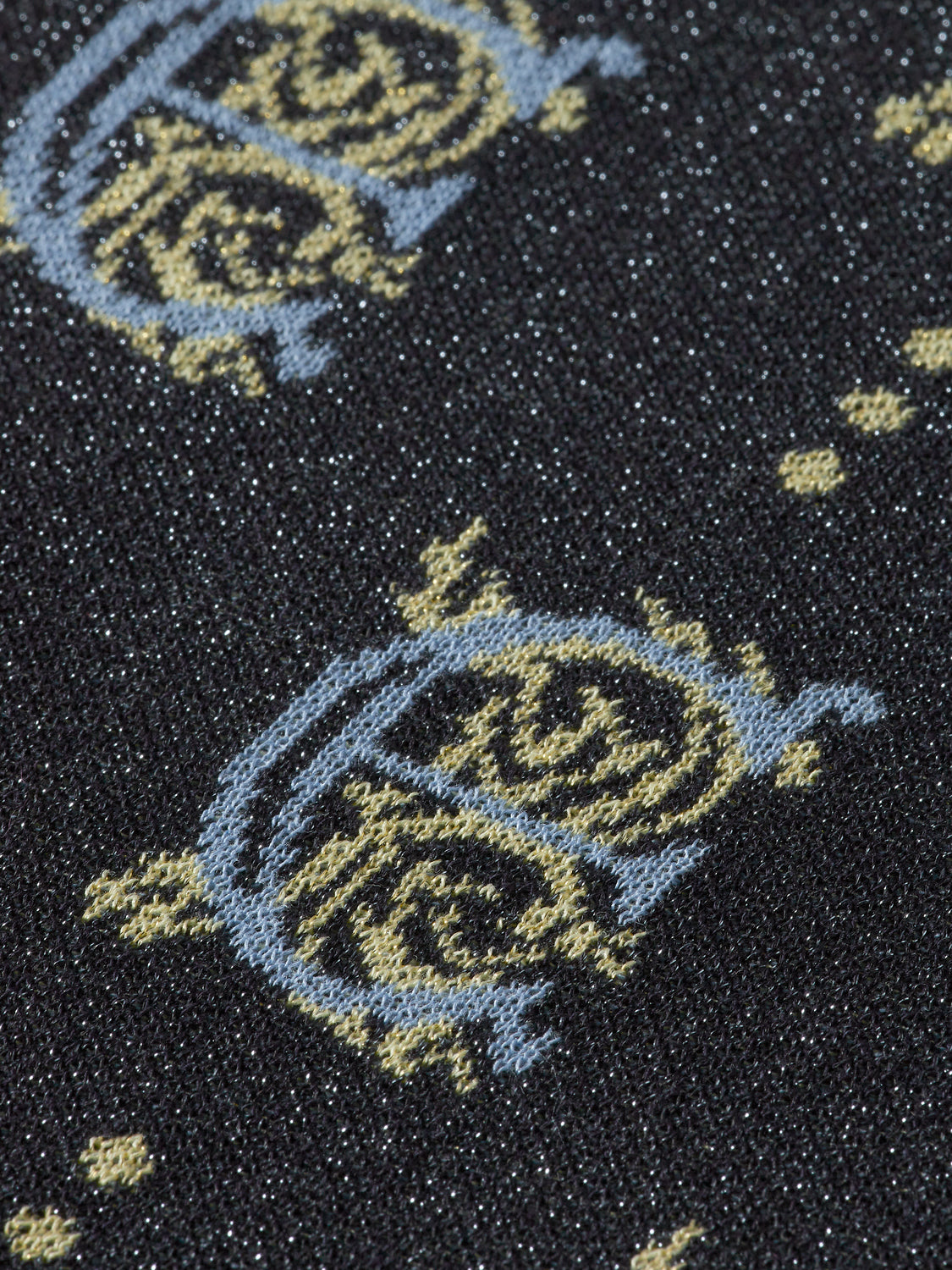 SCOTCH & SODA jacquard cropped knitwear top with intricate pattern, close-up showing textured fabric and stylish design.
