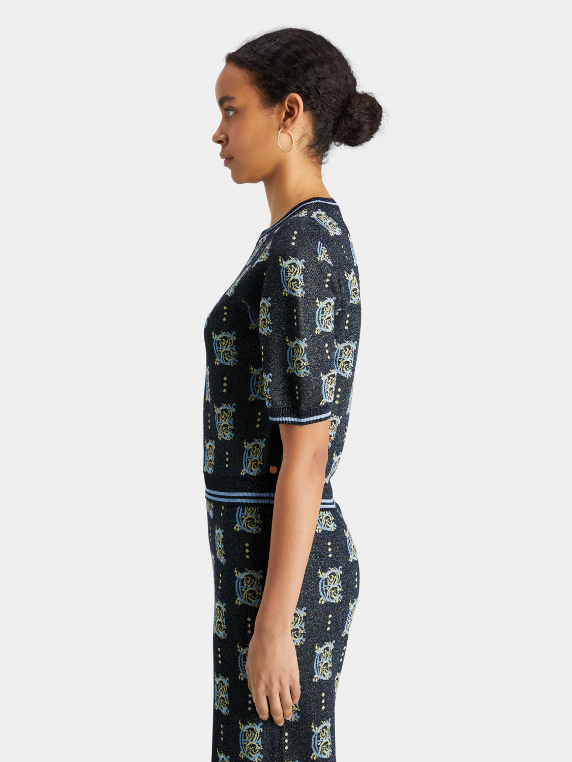 Scotch & Soda jacquard knit cropped top with intricate pattern, short sleeves, and fitted style, shown on a neutral background.
