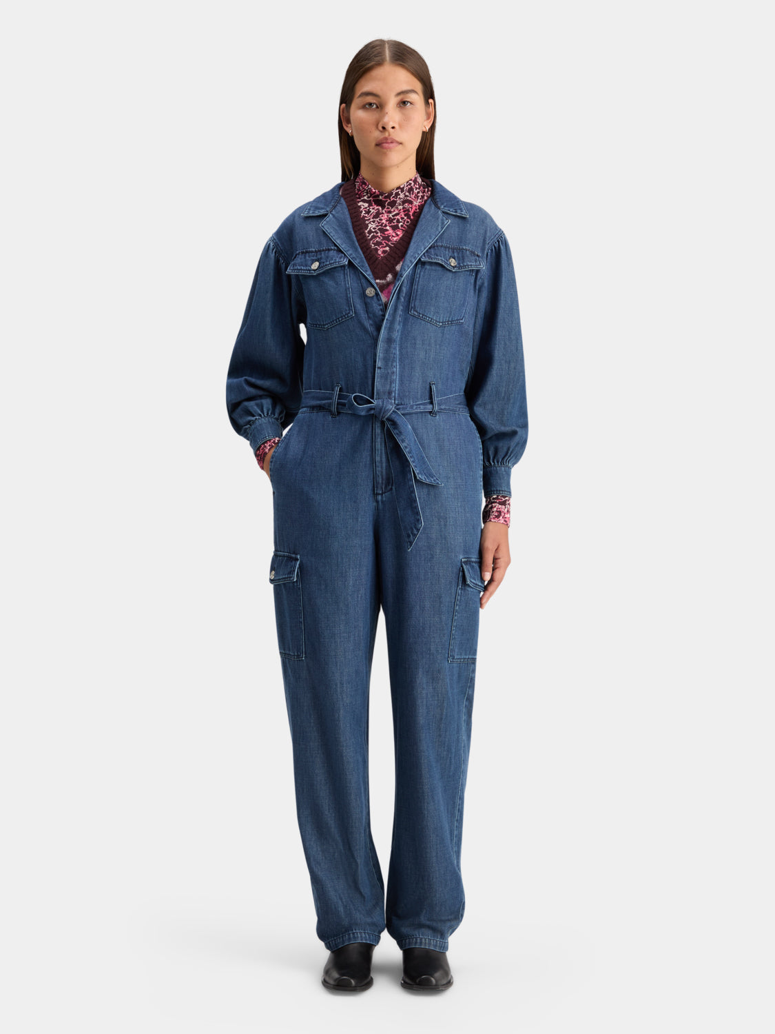 Blue denim jumpsuit by Scotch & Soda featuring a fitted waist and wide-leg pants, displayed on a model.