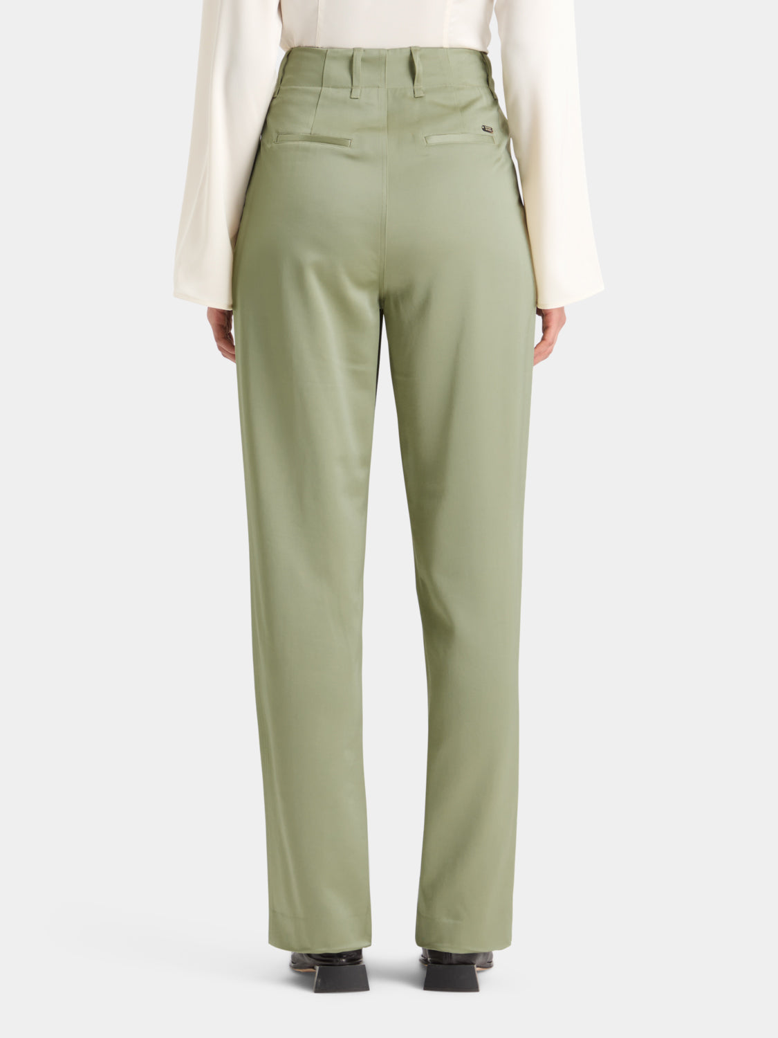 SCOTCH & SODA Faye tapered pants in neutral fabric, shown from the back with a relaxed fit and clean waistband.