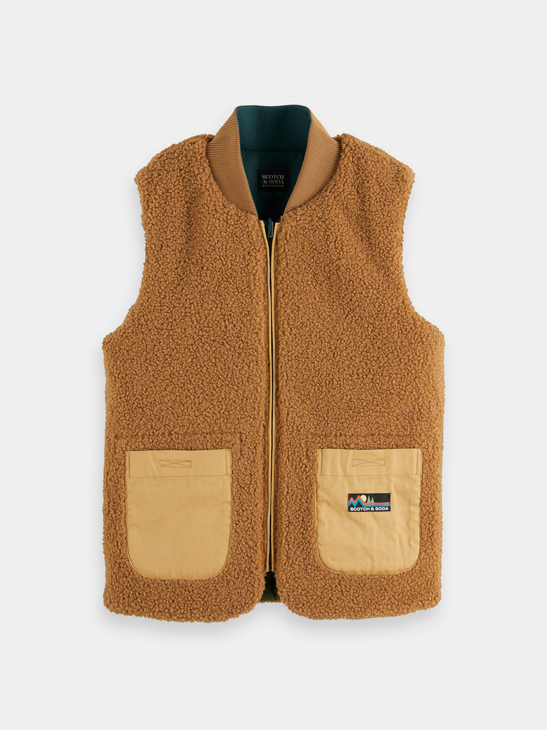 Kids reversible bodywarmer by Scotch & Soda, showing front and back with colorful, insulated design suitable for children.