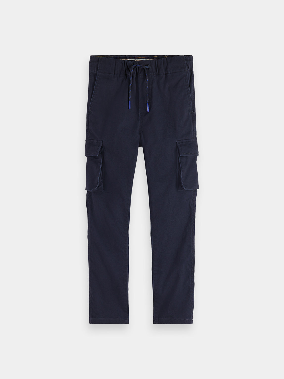 Kids' cargo pants by Scotch & Soda, shown in dark fabric with multiple pockets and relaxed fit.