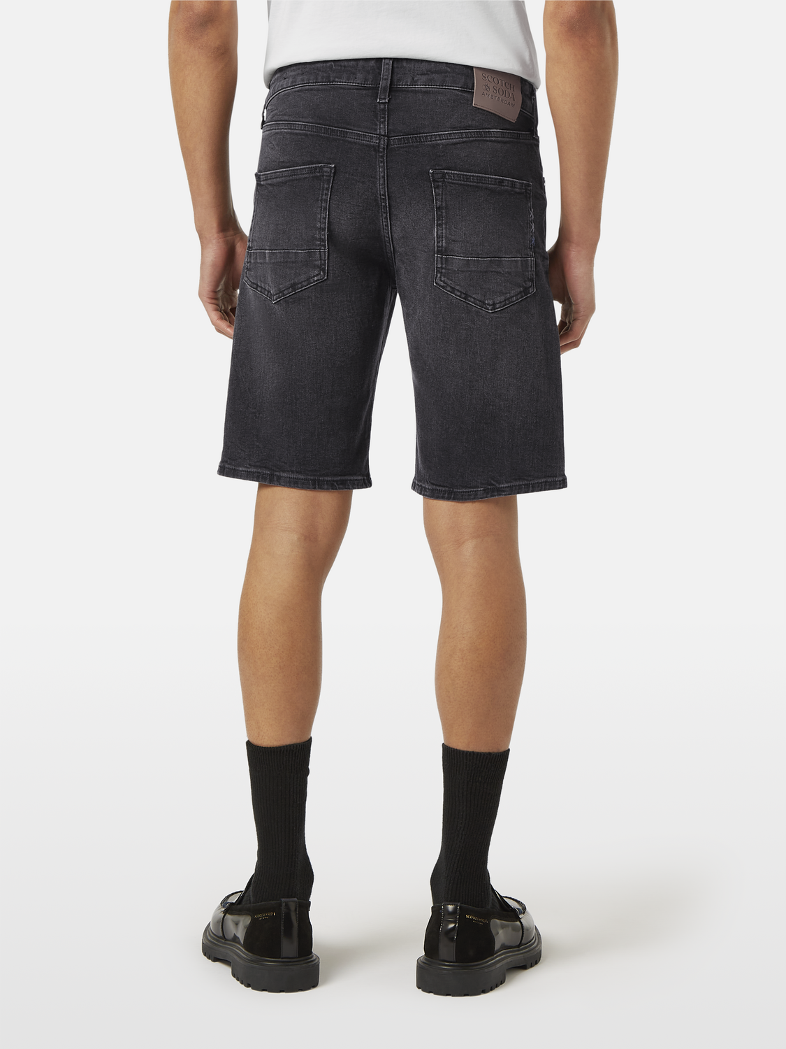 Scotch & Soda Ralston denim shorts with back pockets, casual fit, light blue wash, and distressed details.