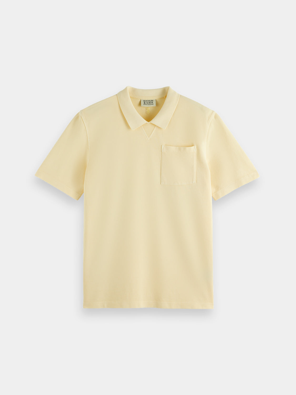 Garment-dyed polo shirt from Scotch & Soda, showing the soft fabric, classic collar, and button placket in natural light.
