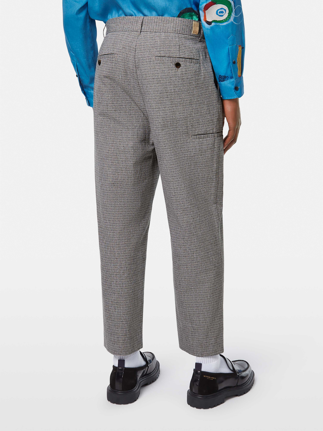 Basket weave chinos pants by Scotch & Soda, showing the textured fabric and classic fit in a natural pose.