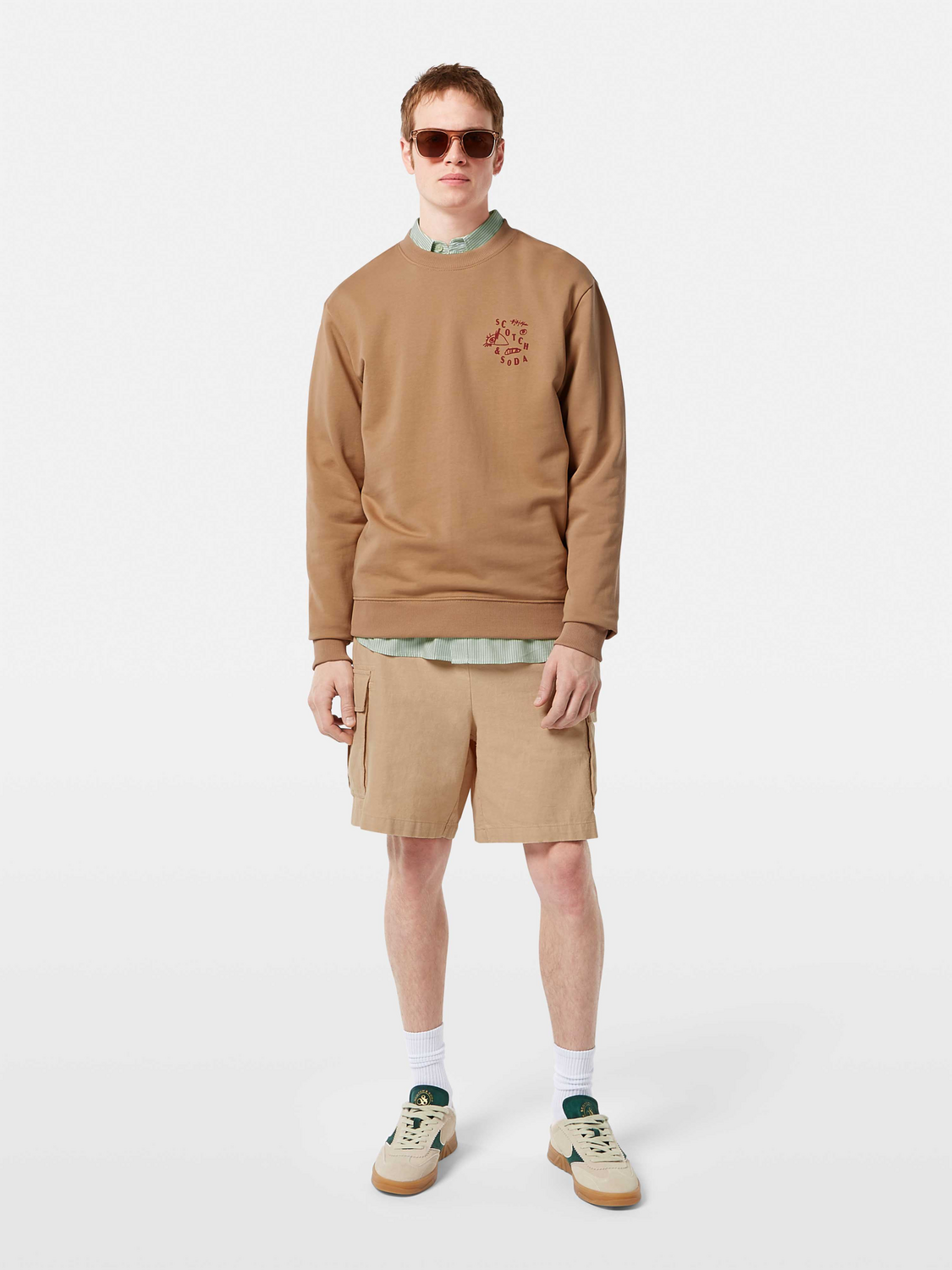 SCOTCH & SODA cargo shorts featuring multiple pockets, casual fit, and durable fabric in a neutral color.