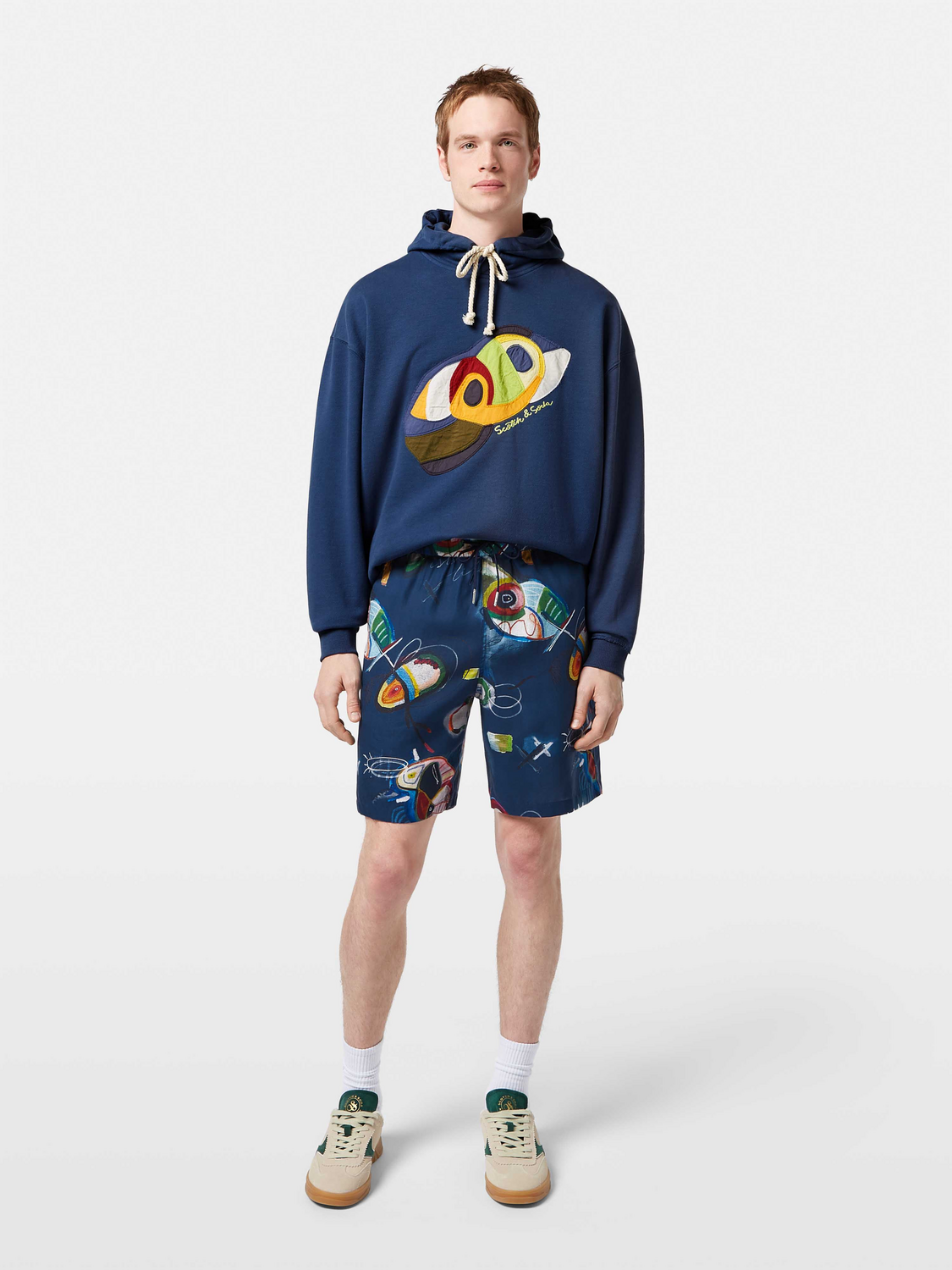 Fave printed shorts by Scotch & Soda featuring colorful, stylish design, displayed on a model against a neutral background.