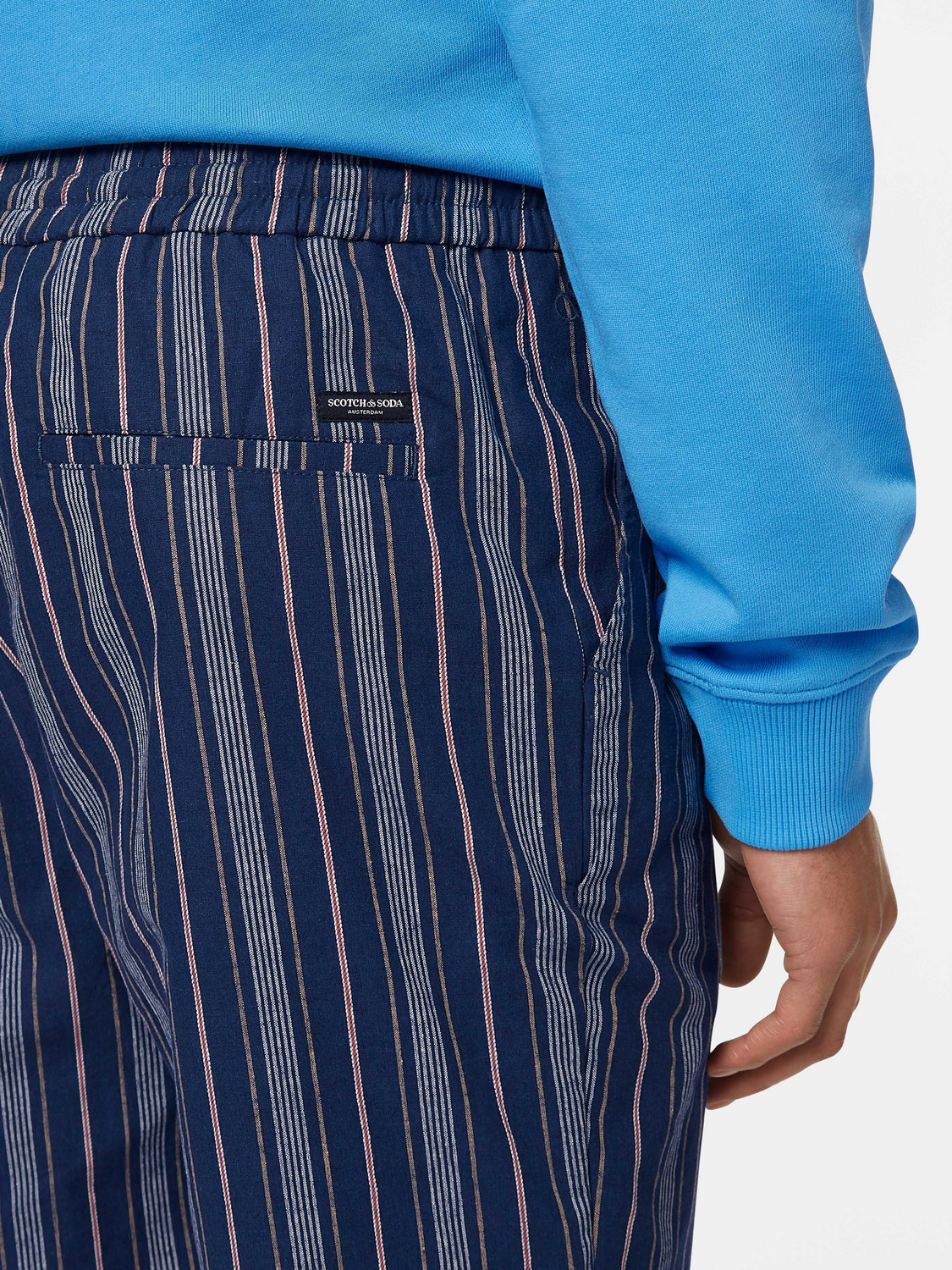 Fave printed shorts by Scotch & Soda featuring vibrant floral pattern and casual fit, displayed on a neutral background.
