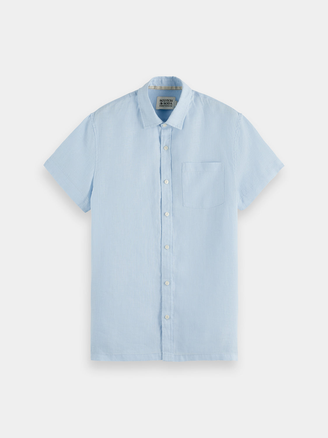Short-sleeved linen shirt by Scotch & Soda displayed on a hanger, featuring a casual, lightweight design in natural fabric.