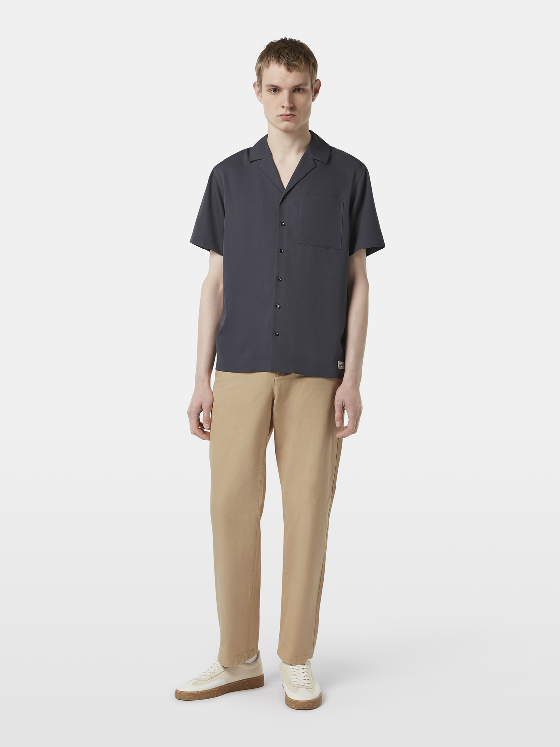 Light beige Scotch & Soda short-sleeved sateen shirt with a classic collar and button front, displayed on a hanger.