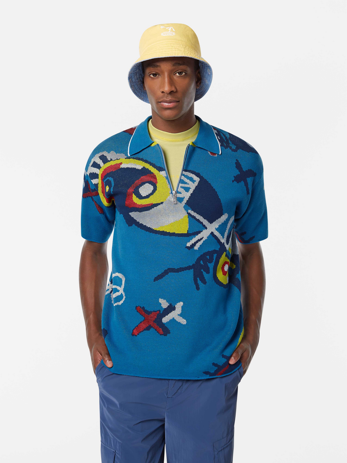 Blue knitted polo shirt from Scotch & Soda featuring a classic collar and textured knit fabric.
