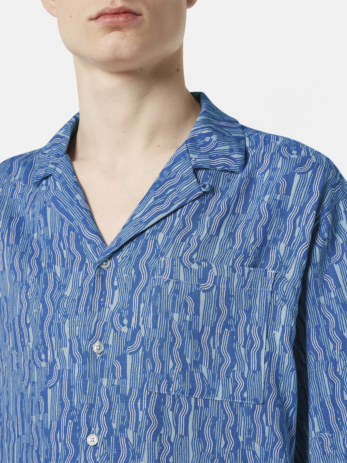 Short-sleeved printed shirt by Scotch & Soda featuring vibrant patterns and lightweight fabric, ideal for casual summer wear.