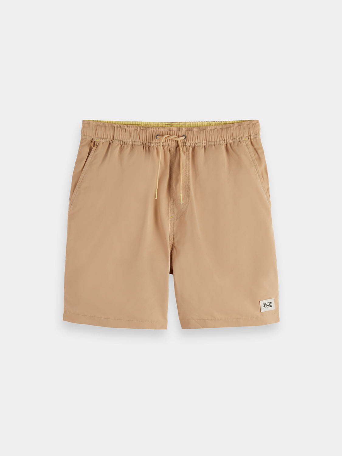 Mid-length SCOTCH & SODA swimshorts in vibrant print, displayed flat with waistband and side pockets visible.