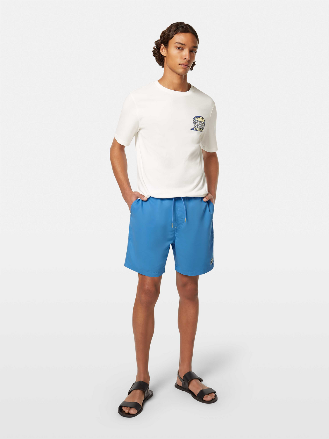 Mid-length SCOTCH & SODA swim shorts in vibrant print, featuring an elastic waistband and side pockets.