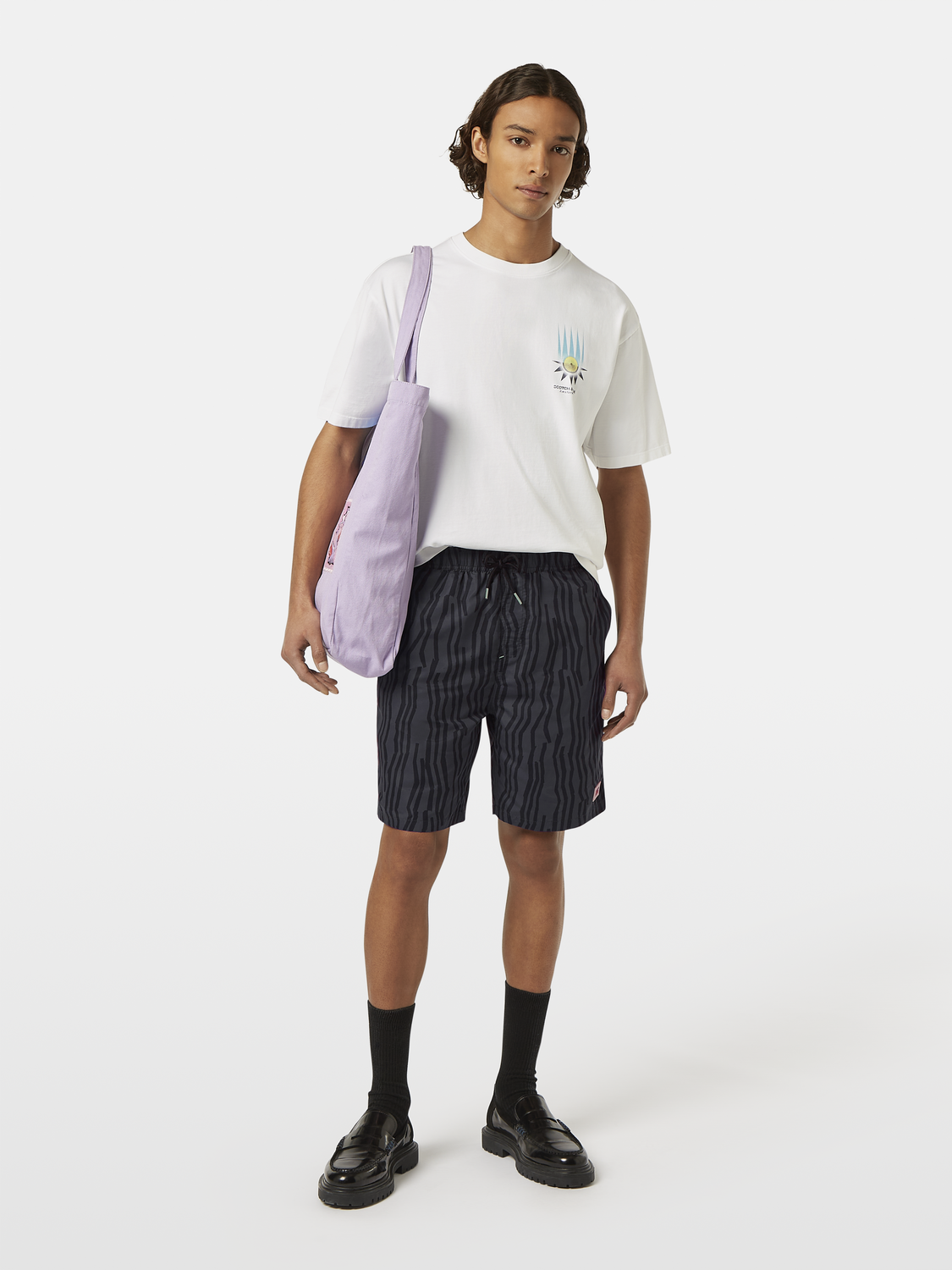 Printed swimshorts from Scotch & Soda featuring colorful tropical pattern, casual fit, and elastic waistband for beach or pool wear.