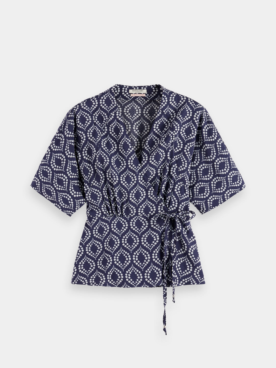 Woven wrap top by Scotch & Soda, featuring a stylish design with long sleeves and a fitted silhouette.