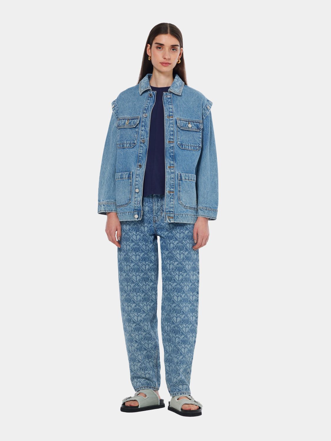 Scotch & Soda washed denim jacket featuring a classic fit, button closure, and front pockets, hanging on a hanger.
