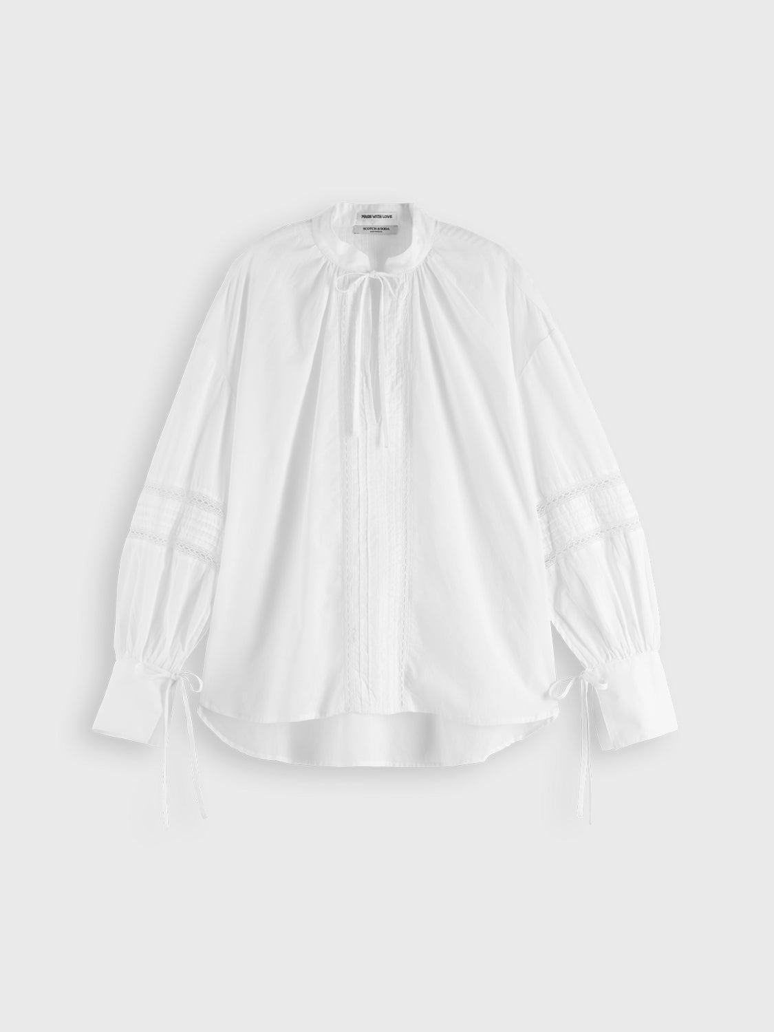 Lace woven tunic top by Scotch & Soda featuring intricate lace details and a relaxed fit, displayed on a neutral background.