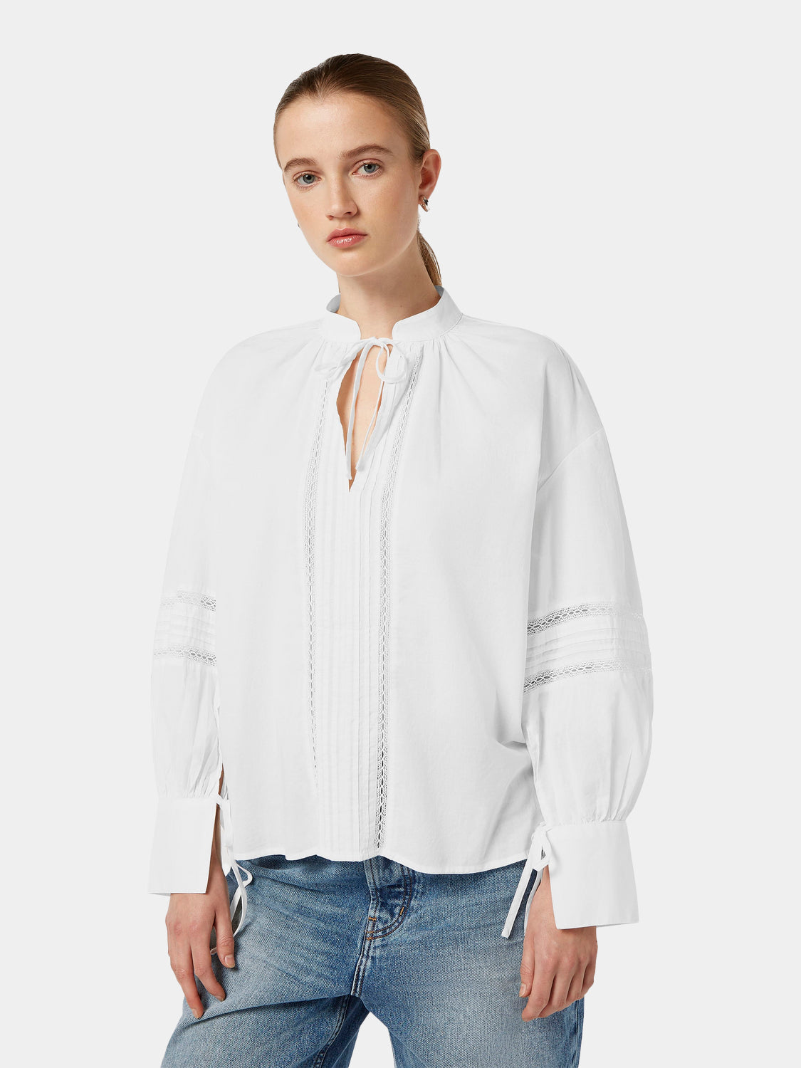 Scotch & Soda lace tunic top featuring intricate woven fabric and a relaxed fit, styled on a model with long sleeves and a v-neck.