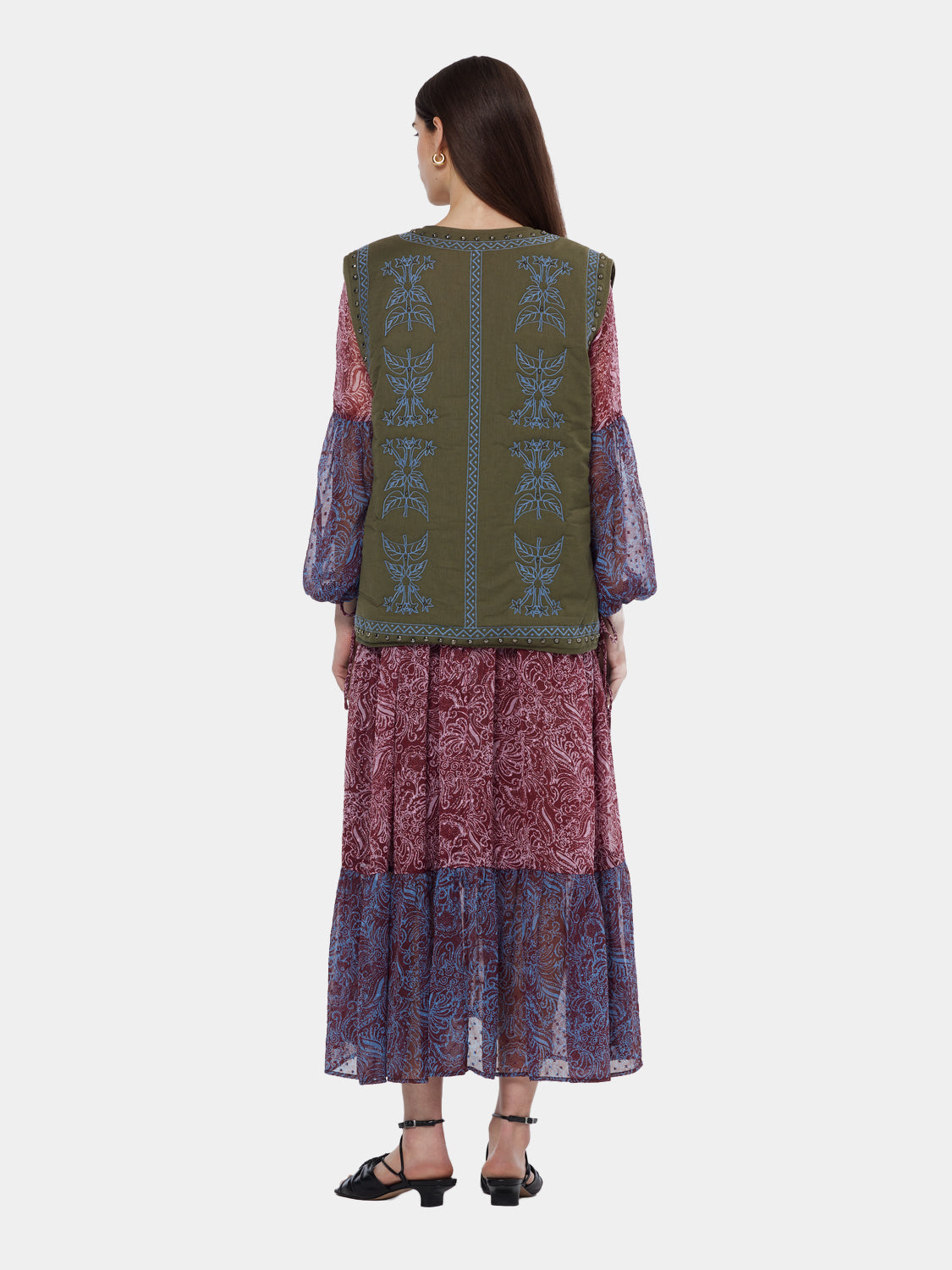 Floral embroidered Scotch & Soda inbetween gilet with intricate embroidery and lightweight fabric on a neutral background.