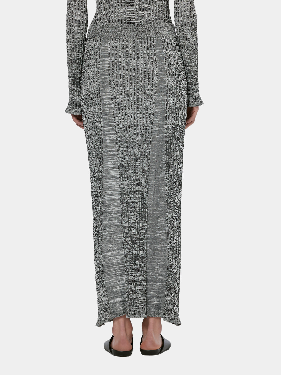 Maxi ribbed knitted skirt by Scotch & Soda, showing the back view with a fitted waist and textured fabric.