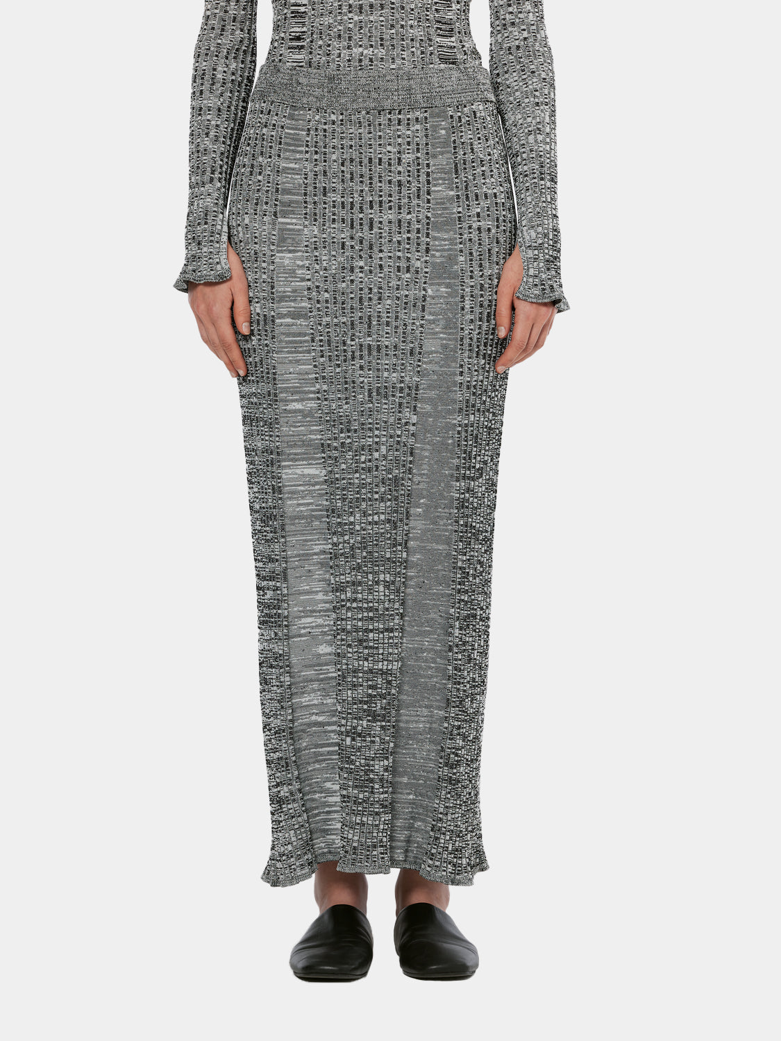 Ribbed knitted maxi skirt from Scotch & Soda featuring a fitted design and textured fabric, shown in a front view.