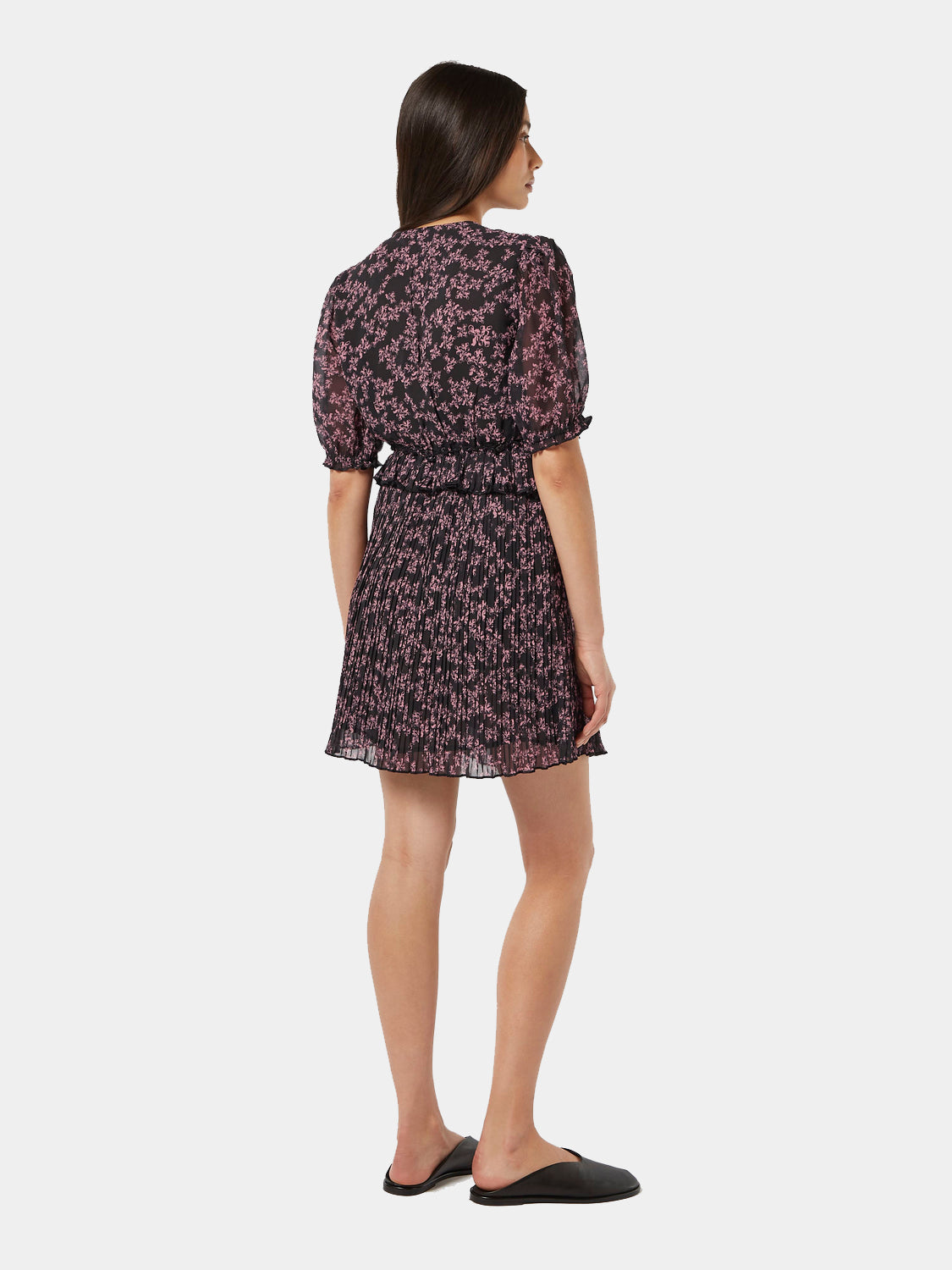 Scotch & Soda pleated mini dress with ruffled hem, sleeveless design, and floral pattern, shown from back view.
