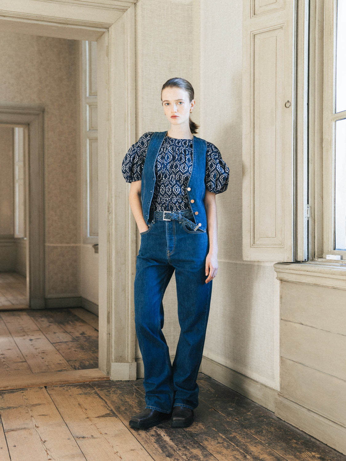 Scotch & Soda glow bootcut denim jeans displayed on a hanger, showcasing the stylish fit and classic denim texture.