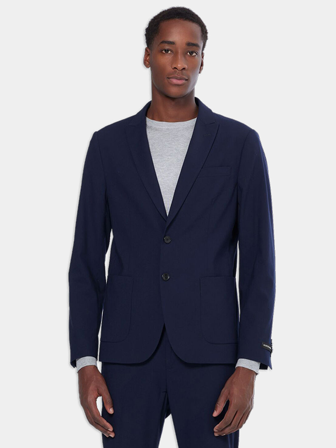 SCOTCH & SODA men's peak lapel blazer in dark fabric, front view showing tailored fit and classic design.